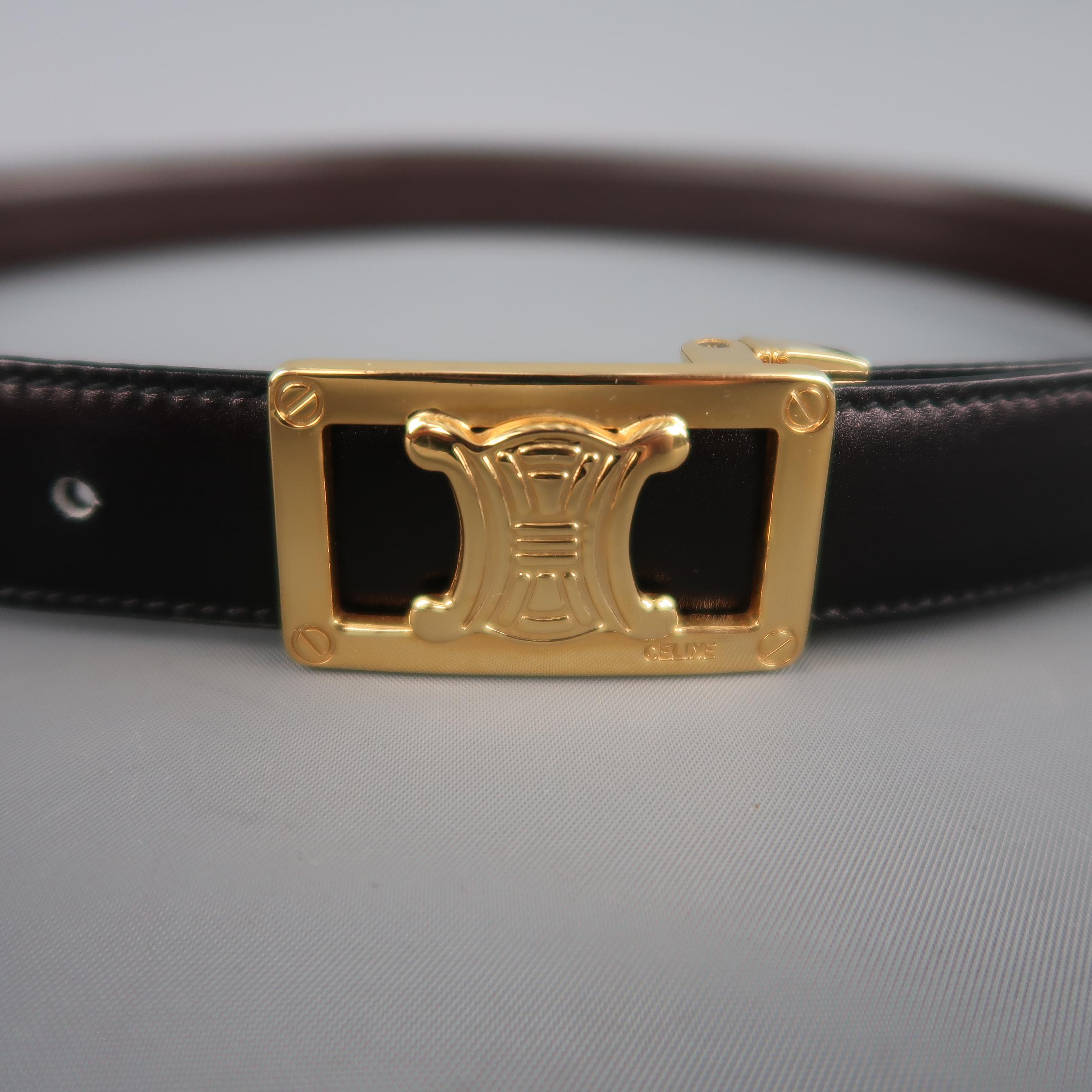 Vintage CELINE dress belt features a reversible black and brown strap with a gold tone cutout logo buckle. Made in Italy.
 
Excellent Pre-Owned Condition.
Marked: (no size)
 
Length: 36.5 in.
Width: 1 in.
Fits: 29-32.5 in.