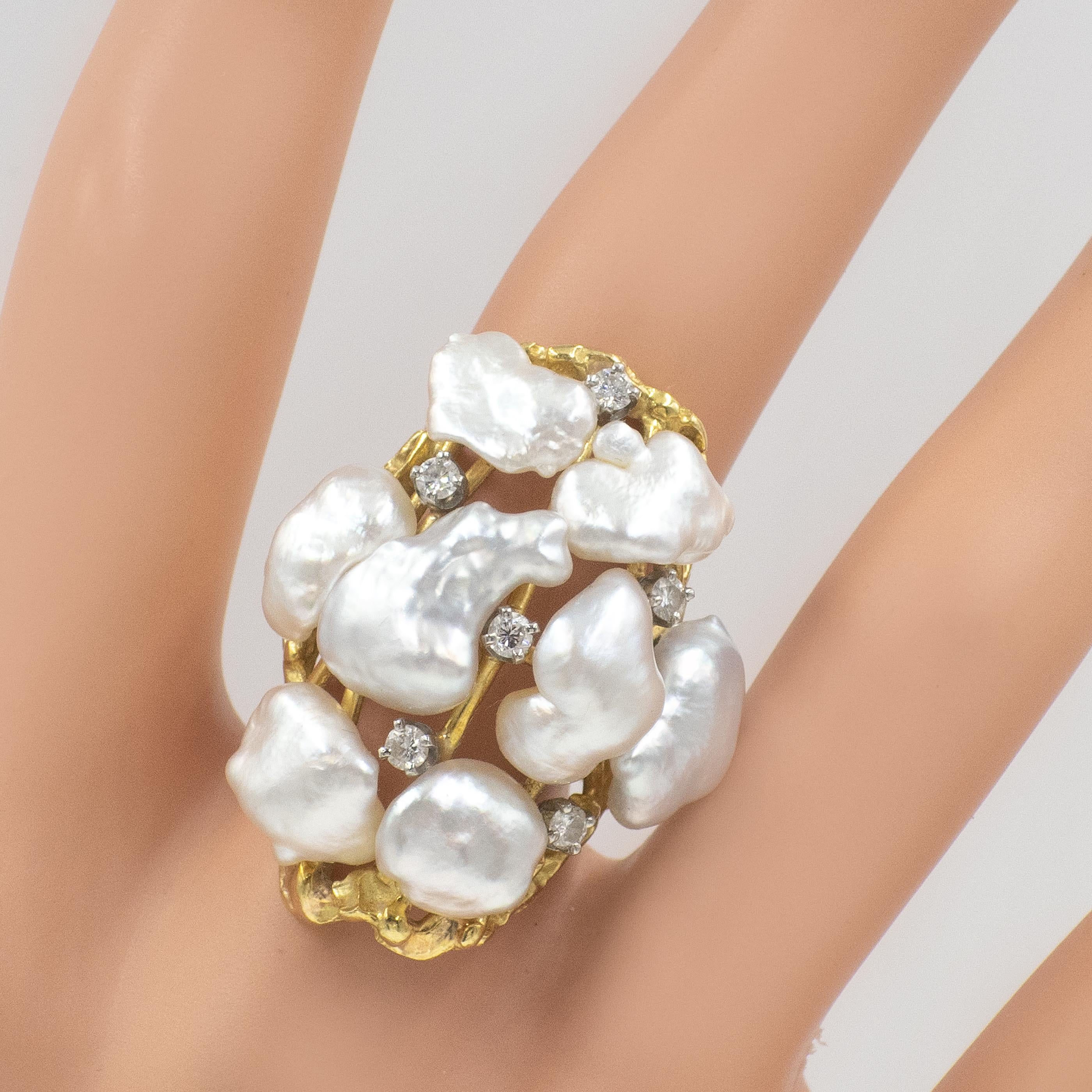 Vintage CELLINO Diamond Pearl cocktail ring with 
6 Diamonds (G-H color / VS clarity)
among 8 Baroque pearls in 18K yellow gold
with cut out designs

Ring Size: 5.75

Approximate Gross Weight ~13.50 grams
Diamonds ~ 0.24 carat in total

Ring Top