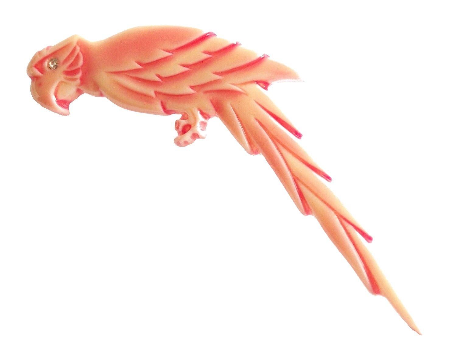 Vintage celluloid coral parrot brooch or pin with a rhinestone eye - unsigned - made in Italy - circa 1950's.

Excellent vintage condition - no loss - no damage - no repairs - ready to wear.

Size - 2 3/4