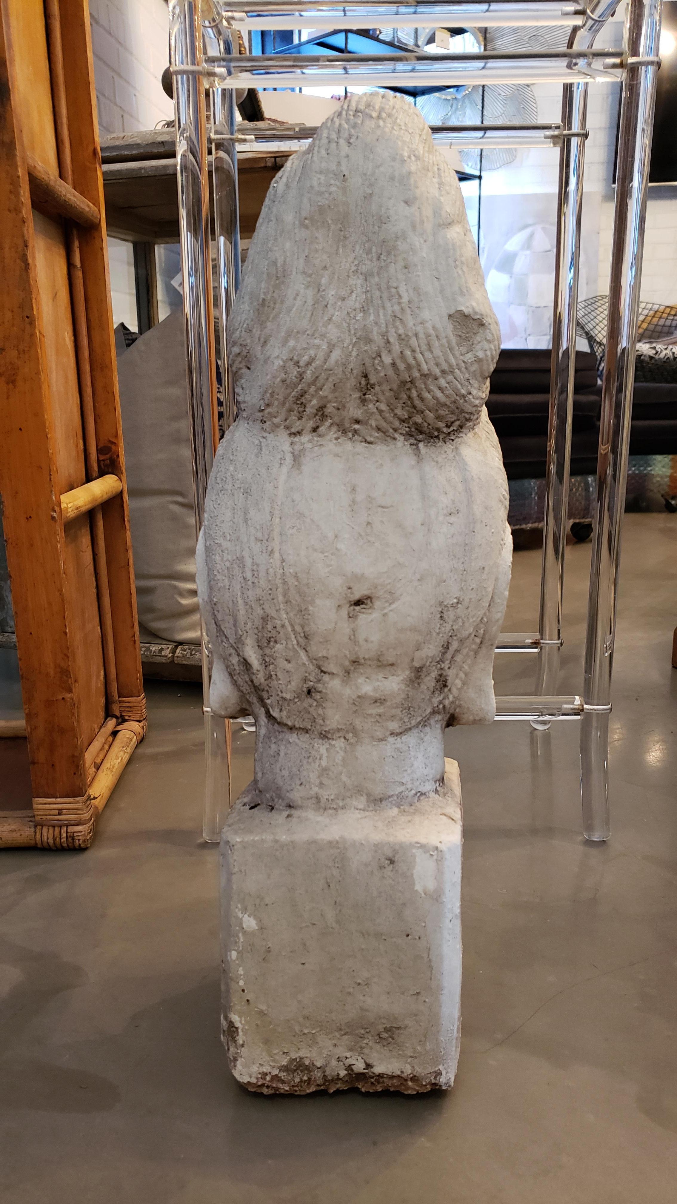 This Buddha sculpture has all the right patina and chipping to feel anything but reproduced. It is truly a classic artistic element for either indoor or garden display.