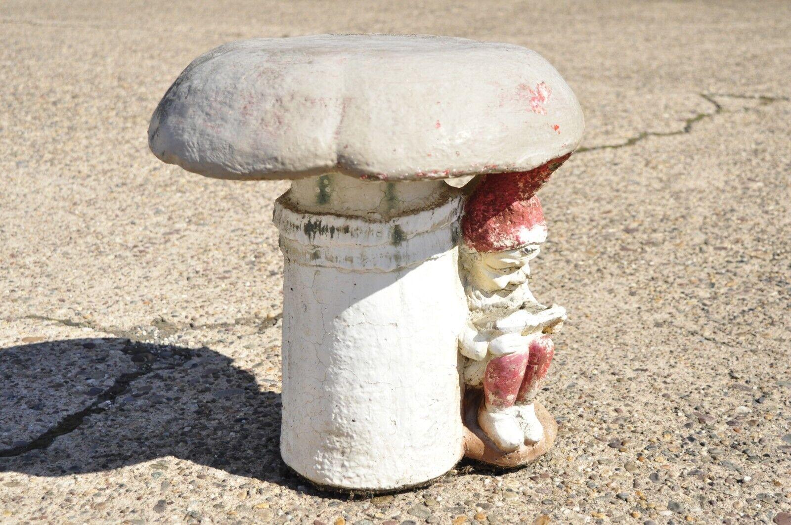 Vintage Cement Concrete Figural Elf under Mushroom Garden stool seat. Item features a unique form with elf resting under mushroom, approx. 75 lbs, very nice vintage item. Circa Mid 20th Century. Measurements: 17
