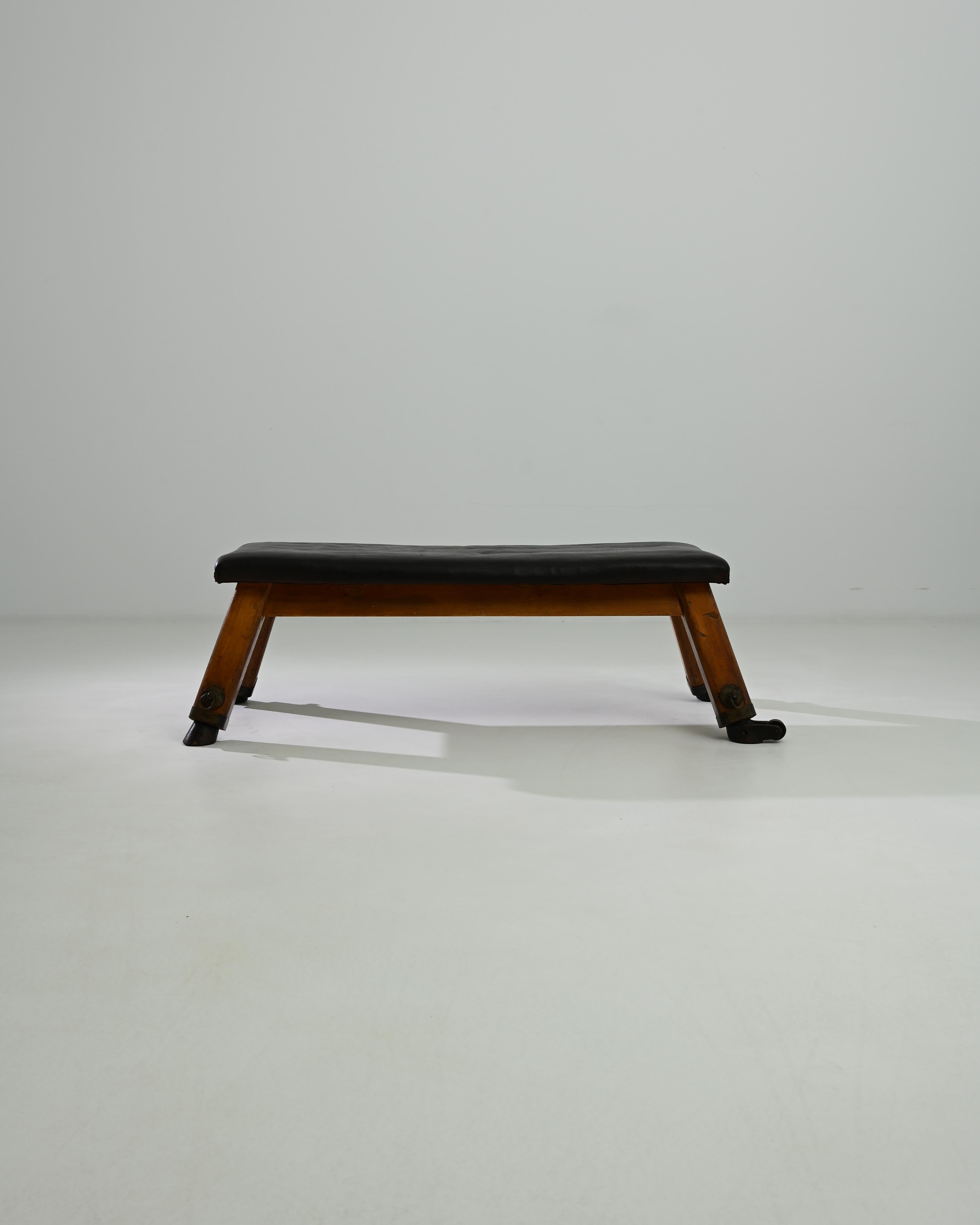 This leather pommel horse was made in Central Europe, circa 1950. A unique bench with a sense of history; hand-crafted quality emits a sense of the robust – utility and a restful sense of ease. Originally used by gymnasts for swinging and balancing