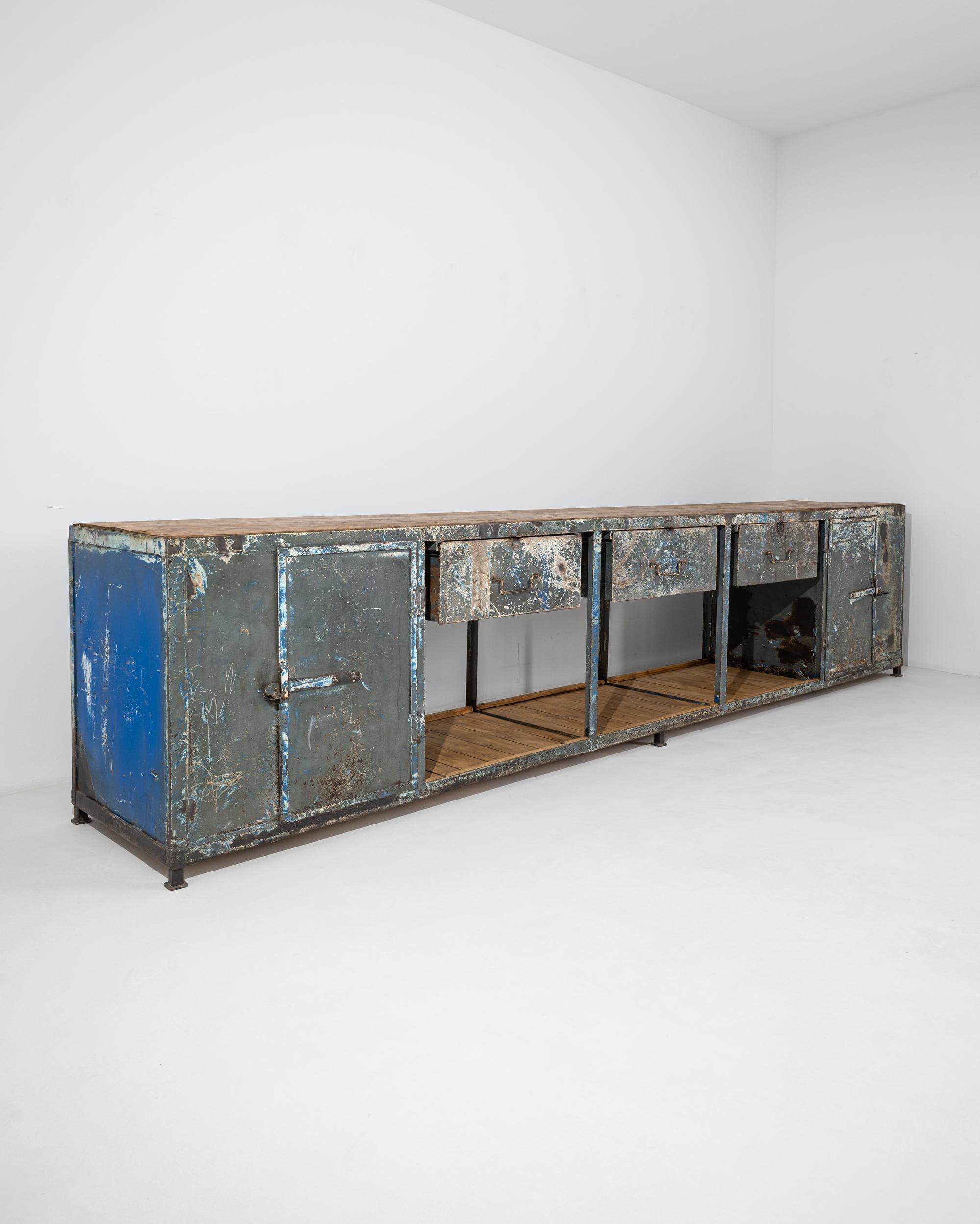 The distressed surface of this vintage metal work table gives it a distinctive post-industrial aesthetic. Made in Central Europe in the 20th century, the pragmatic design indicates that this piece would have once been used in a workshop or factory.