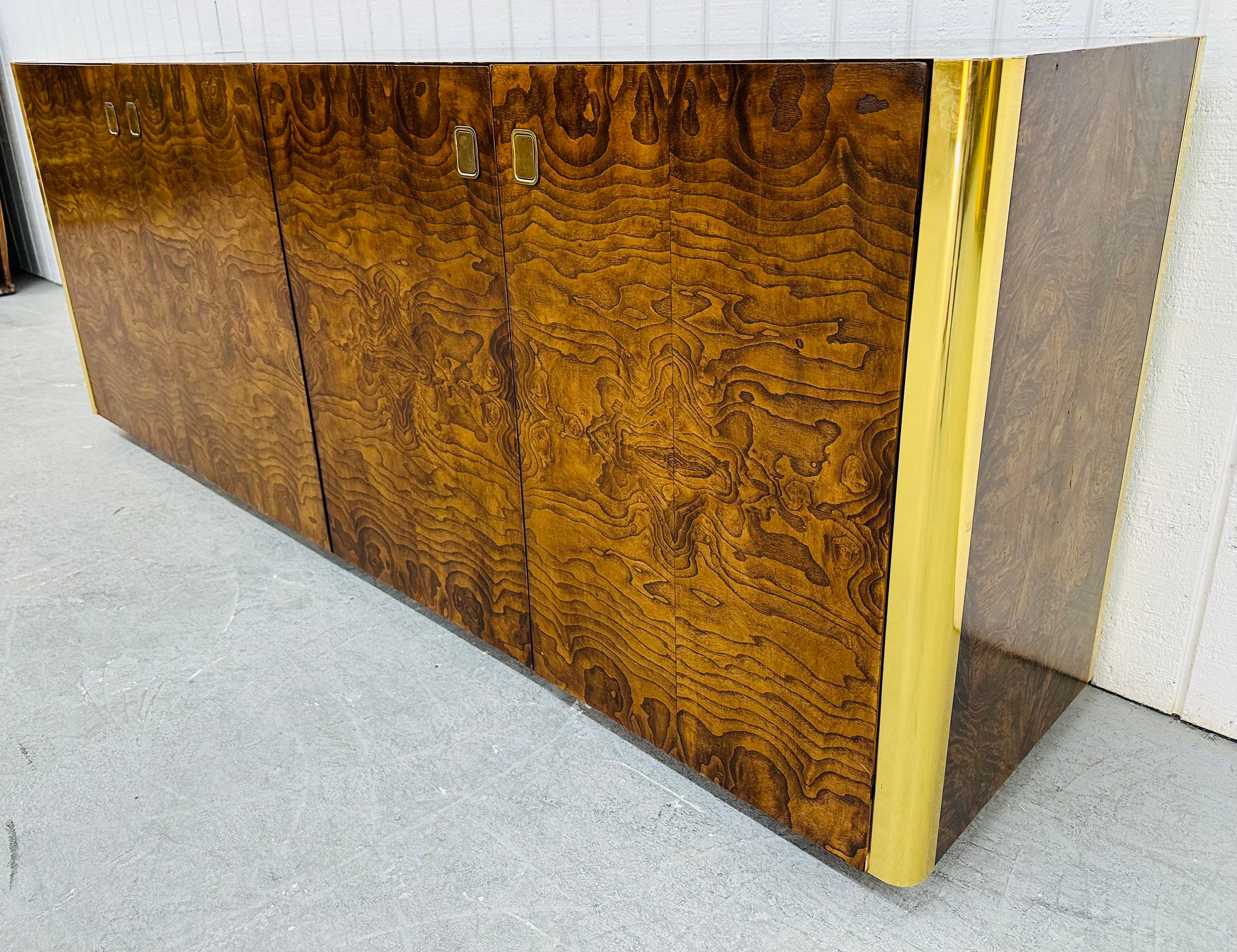 This listing is for a Vintage Century Furniture Burled Walnut Sideboard. Featuring a straight line design, two doors on the left that open up to a hidden drawer and storage space, two doors on the right that open up to a hidden drawer and storage