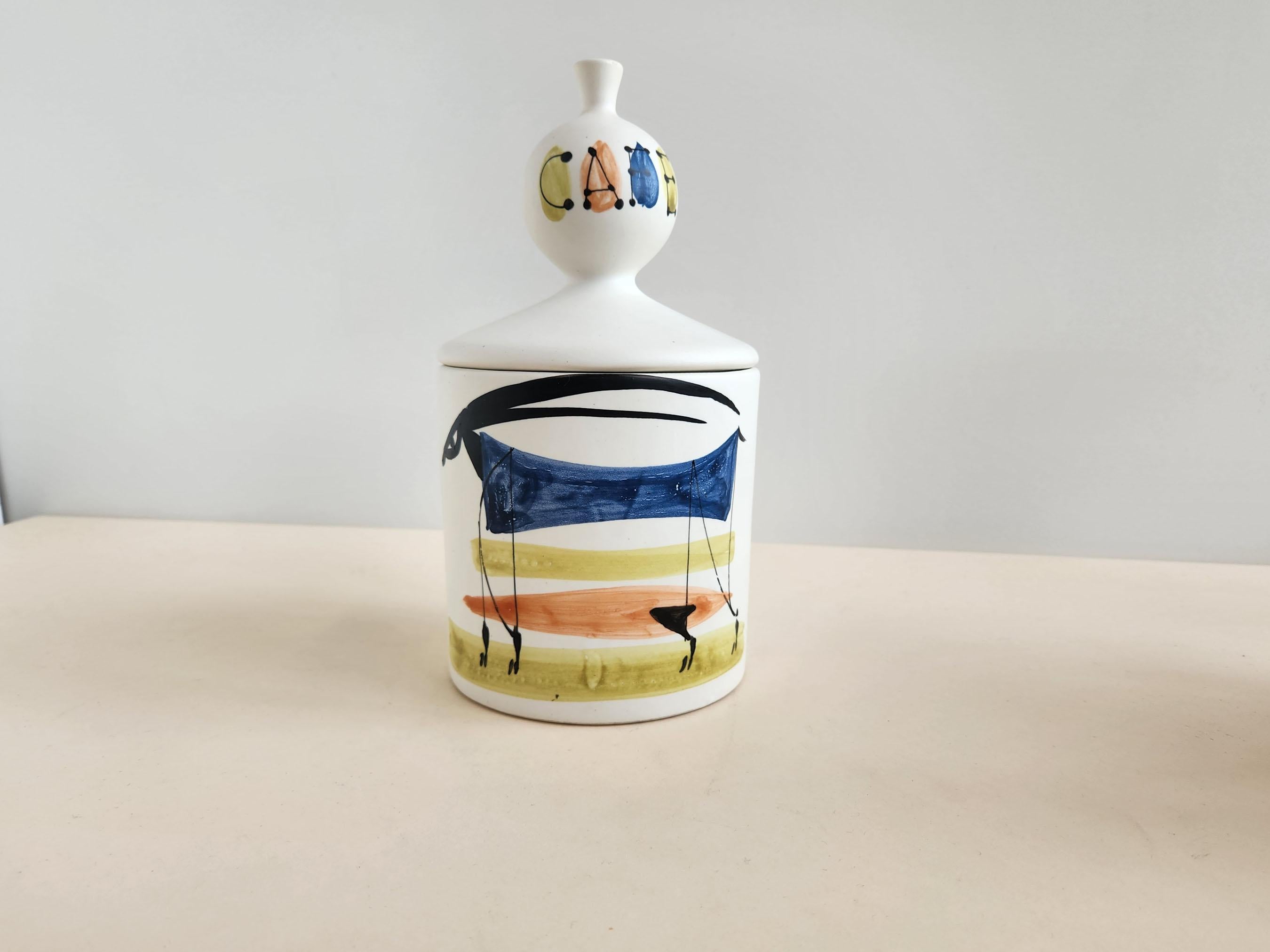 Vintage Ceramic Coffee Jar with Lid by Roger Capron - Vallauris, France

Roger Capron was in influential French ceramicist, known for his tiled tables and his use of recurring motifs such as stylized branches and geometrical suns.   He was born in