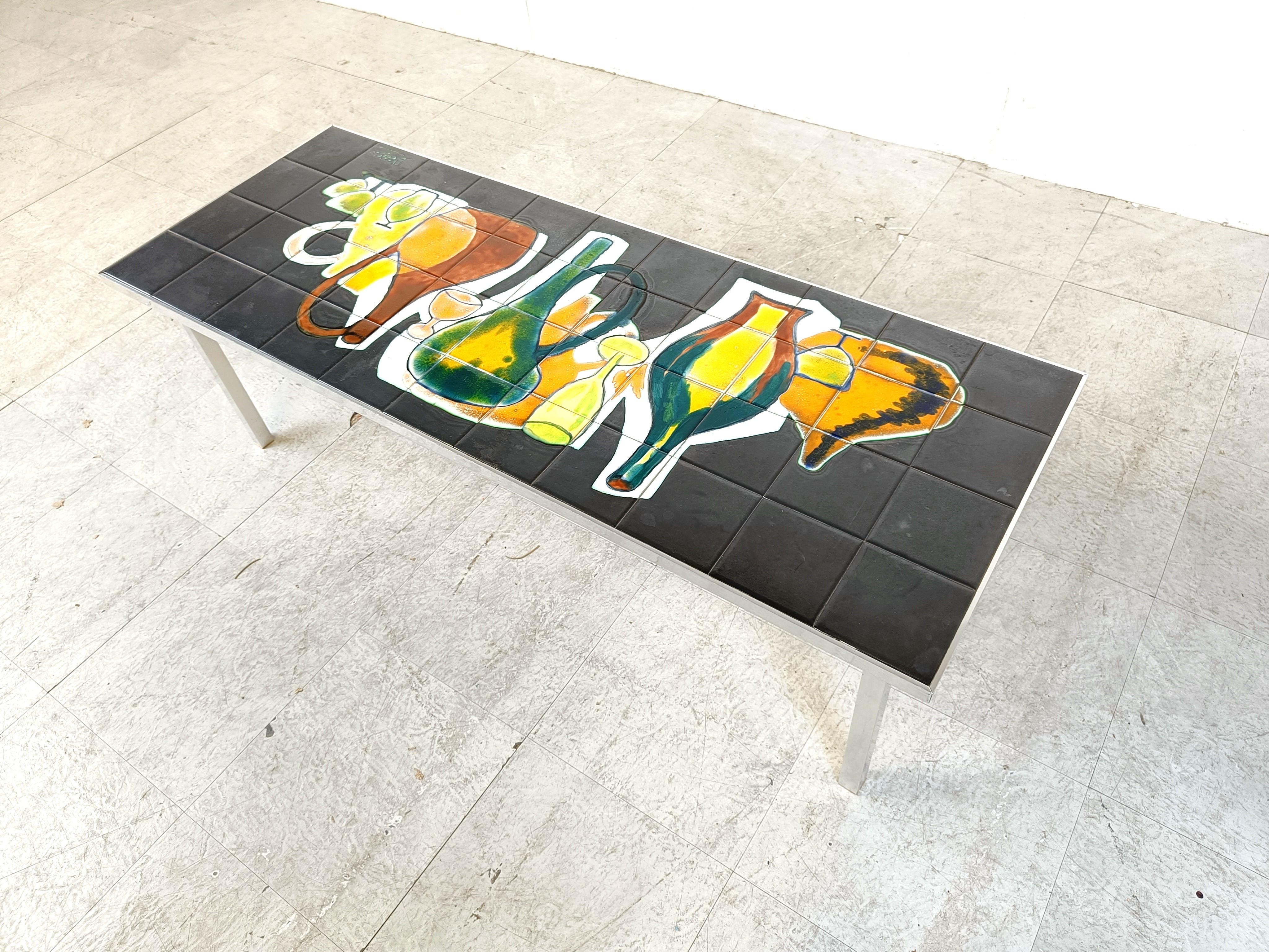 Mid century ceramic tile coffee table with bottles decor

Beautifully decorated tiled table top on a chrome frame.

Very good condition

1960s - Belgium

Height: 38cm/14.96
