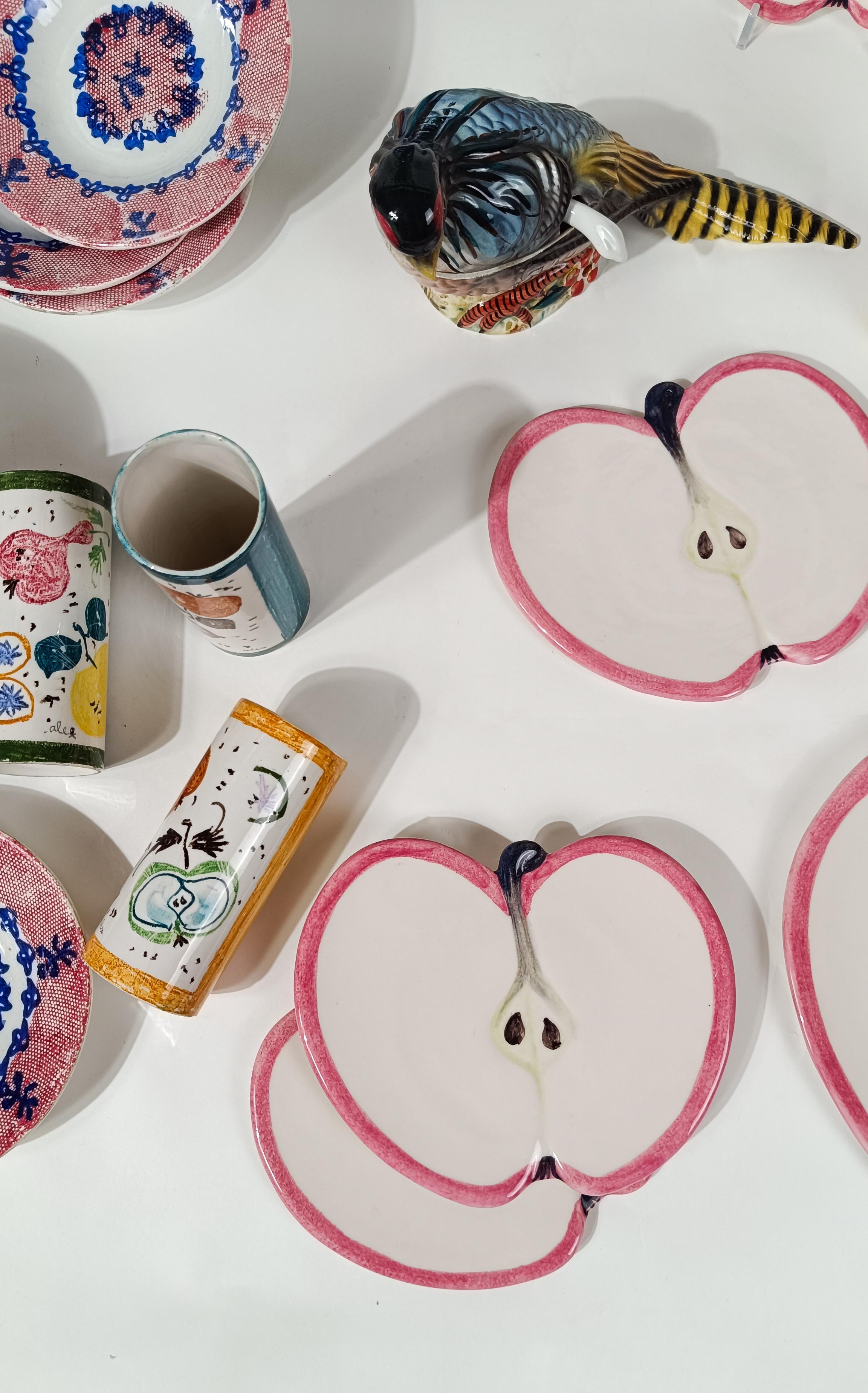 We offer for sale a set of fun and playful dessert plates, hand crafted and hand painted in Italy around the 70s by the M.A.C. (Maestri d'Arte Ceramica) factory in Salerno, as attested by the signature under the serving plate.
In this vintage plate