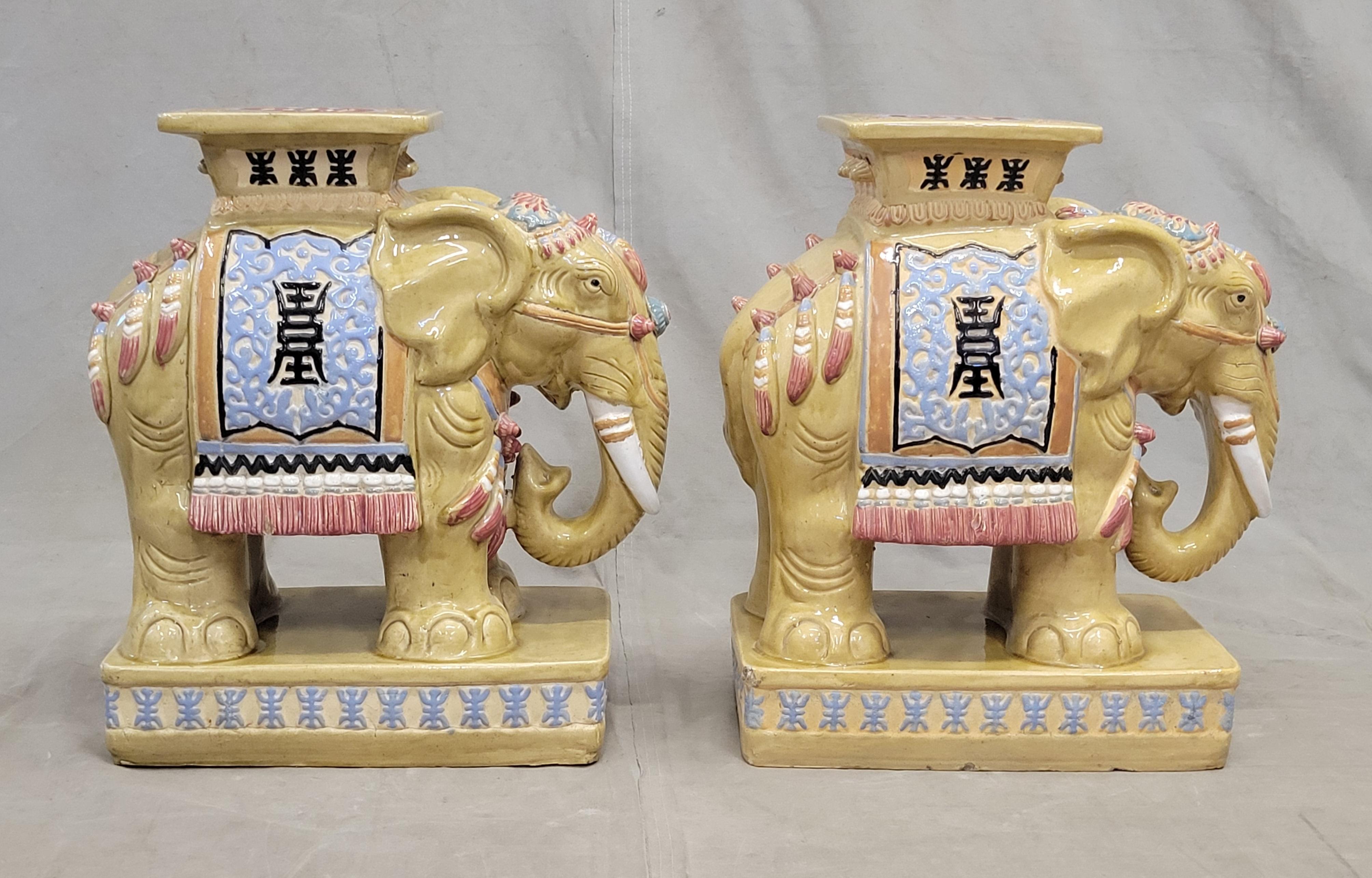 Such a charming pair of vintage Chinese elephant garden stools. Shades of tan/yellow, white, rose colored pink, pale blue, teal blue, navy blue and black. A fun accent either in a garden or in an interior setting.
In as found condition. See last
