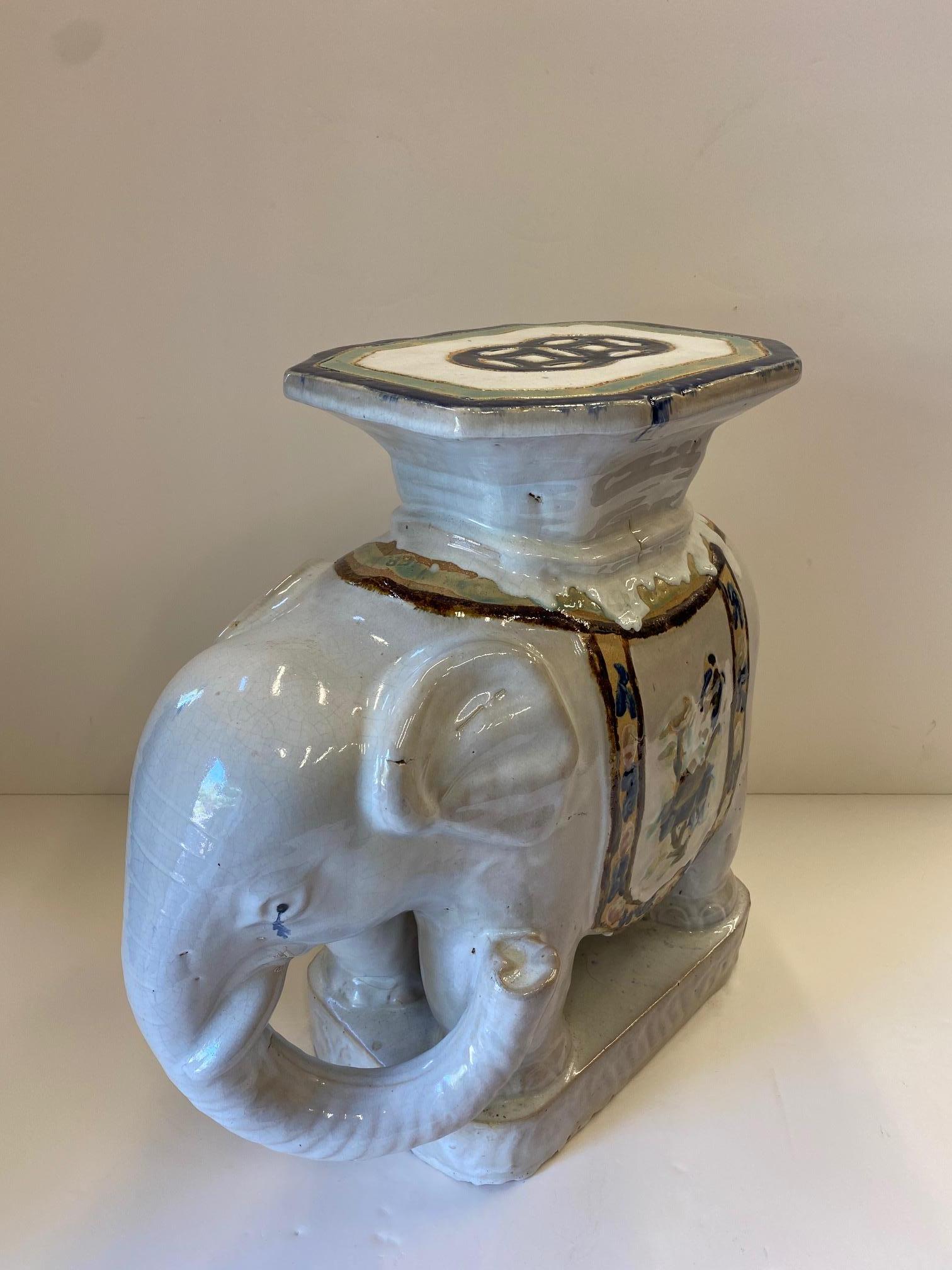 Wonderful vintage ceramic garden seat drinks table in the shape of an elephant having unusual drippy glaze, octagonal shaped top, and handsome decoration.