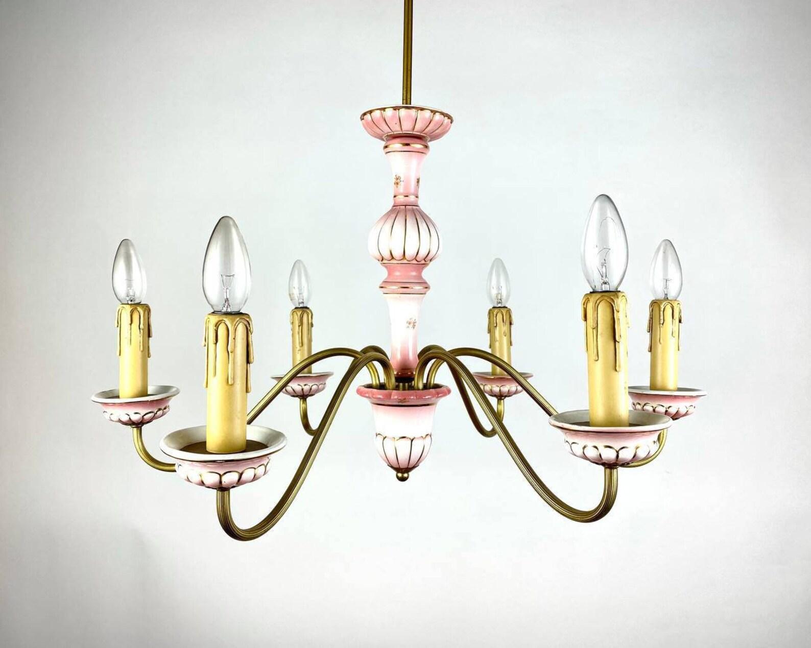 Elegant Handmade ceramic floral Designer chandelier. 

 Hanging 6 horn chandelier, made of brass frame in gold color, body and bobeches with decorative elements of ceramics in pink. 

 Thoughtful design is also achieved through a well-chosen