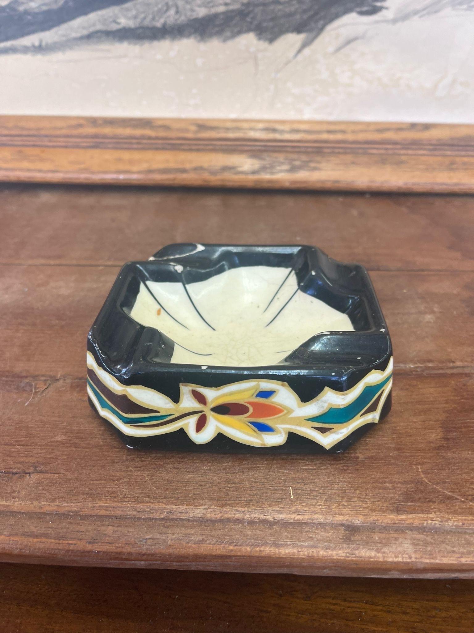 Traditional design atop this unique Ashtray. Maker mark on the bottom, stating that was made in Holland. Vintage Condition Consistent with Age as Pictured.

Dimensions. 5 W ; 4 1/2 D ; 2 H