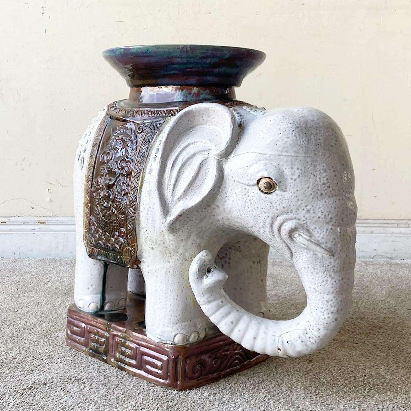 Amazing vintage Asian ceramic elephant side table/sculpture. Features a hand painted finish of gray and brown.