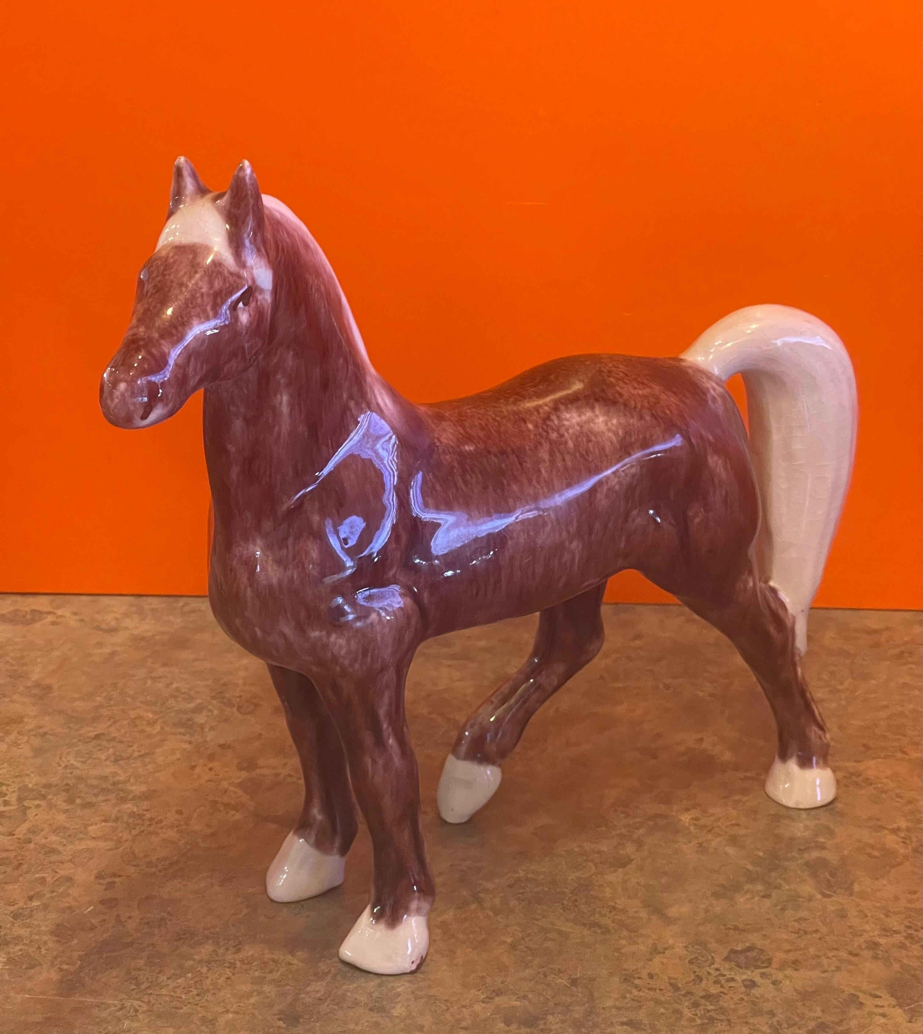 A great handmade ceramic horse sculpture by Dorothy Kindell, circa 1940s. This rare piece is quite large, in good vintage condition (some minor crazing is present) and measures approcimately 12