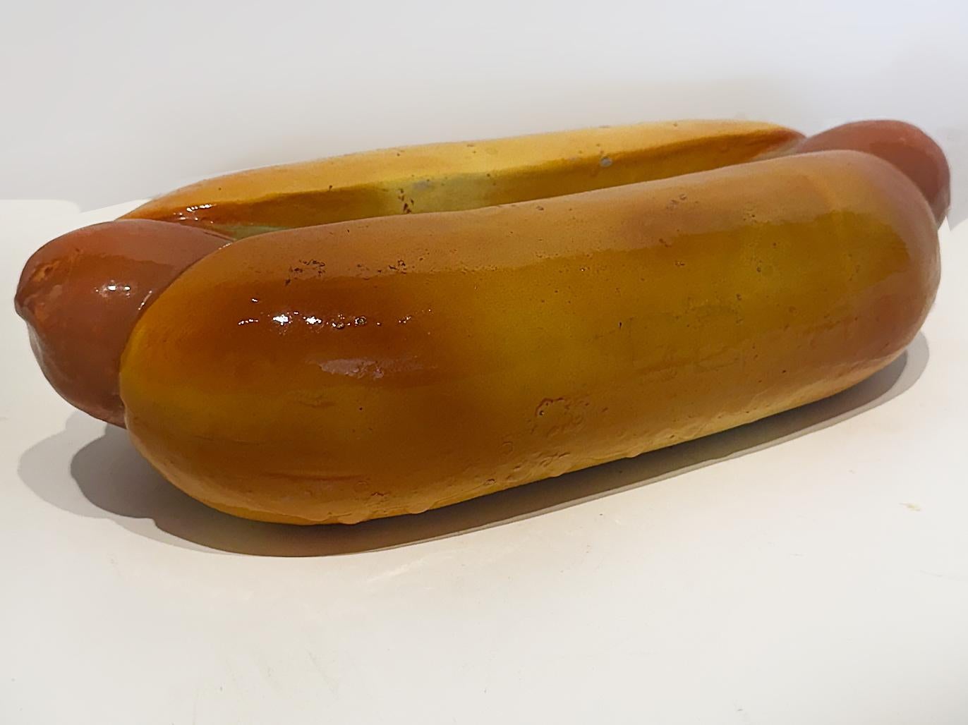 Vintage Ceramic Hot Dog and Hamburger Banks, Set of Two

Offered for sale is a vintage whimsical hot dog and hamburger bank set.  The life size ceramic pieces look extremely realistic  but have slots to drop coins in on the tops.  The bases are