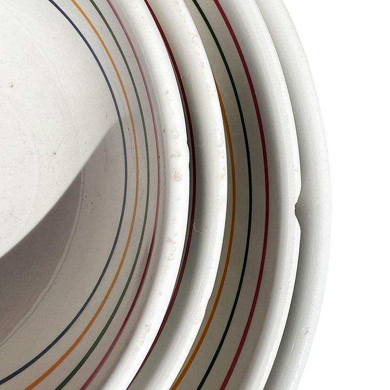 A set of four vintage ceramic serving bowls or mixing bowls by La Primula. This set will be a great way to add Italian flair to your next gathering! This set includes four bowls, one each larger than the next. They are round and fit snuggly into one