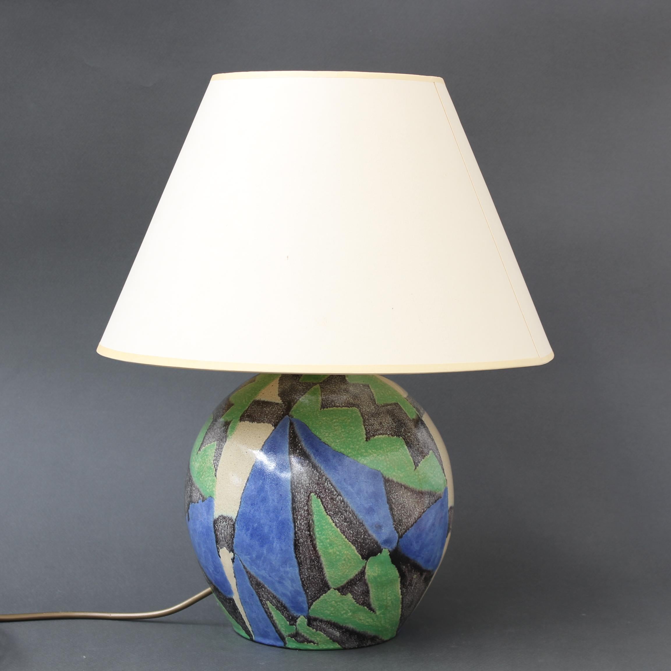 Vintage ceramic lamp by Marcel Noverraz (circa 1960s). A thoroughly modern design with vibrant colours are what propel this ceramic lamp to catch your eye. The patterns defined by the colours are geometric or abstract. They are stunning. Without the