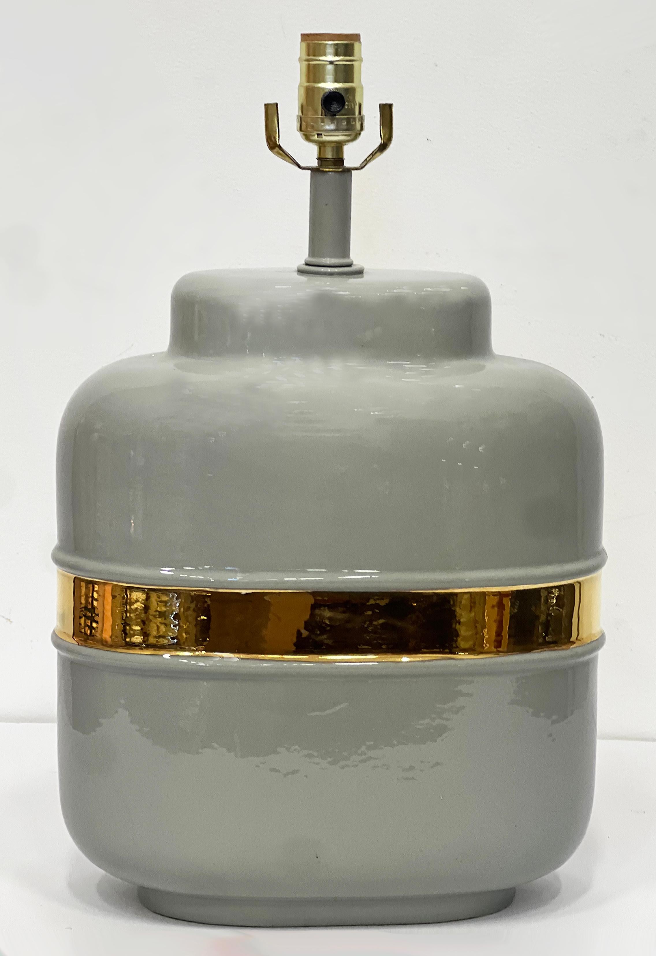 Vintage Ceramic Lamps with Glazed Gold Bands in Jaru Style, Pair


Offered for sale is a vintage pair of circa 1970s ceramic lamps with great contrast between the gold glazed bands and the gray glaze. The lamps are created in the style of Jaru and