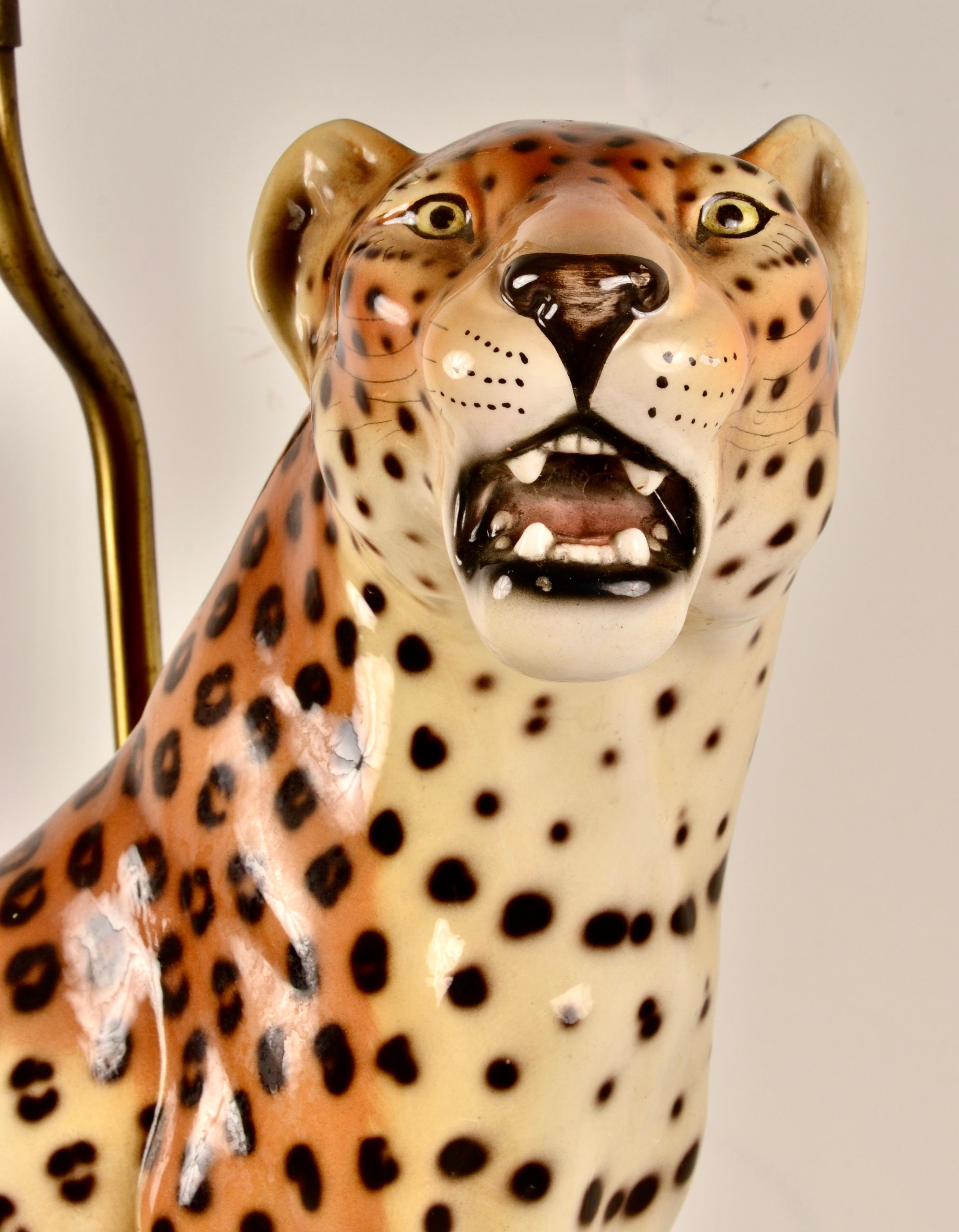 Wonderfully rendered leopard in fine Italian ceramic. Such character! Close attention to detail and quality. Mounted as a lamp on a free-form wood base. Newly wired in black silk cord. 