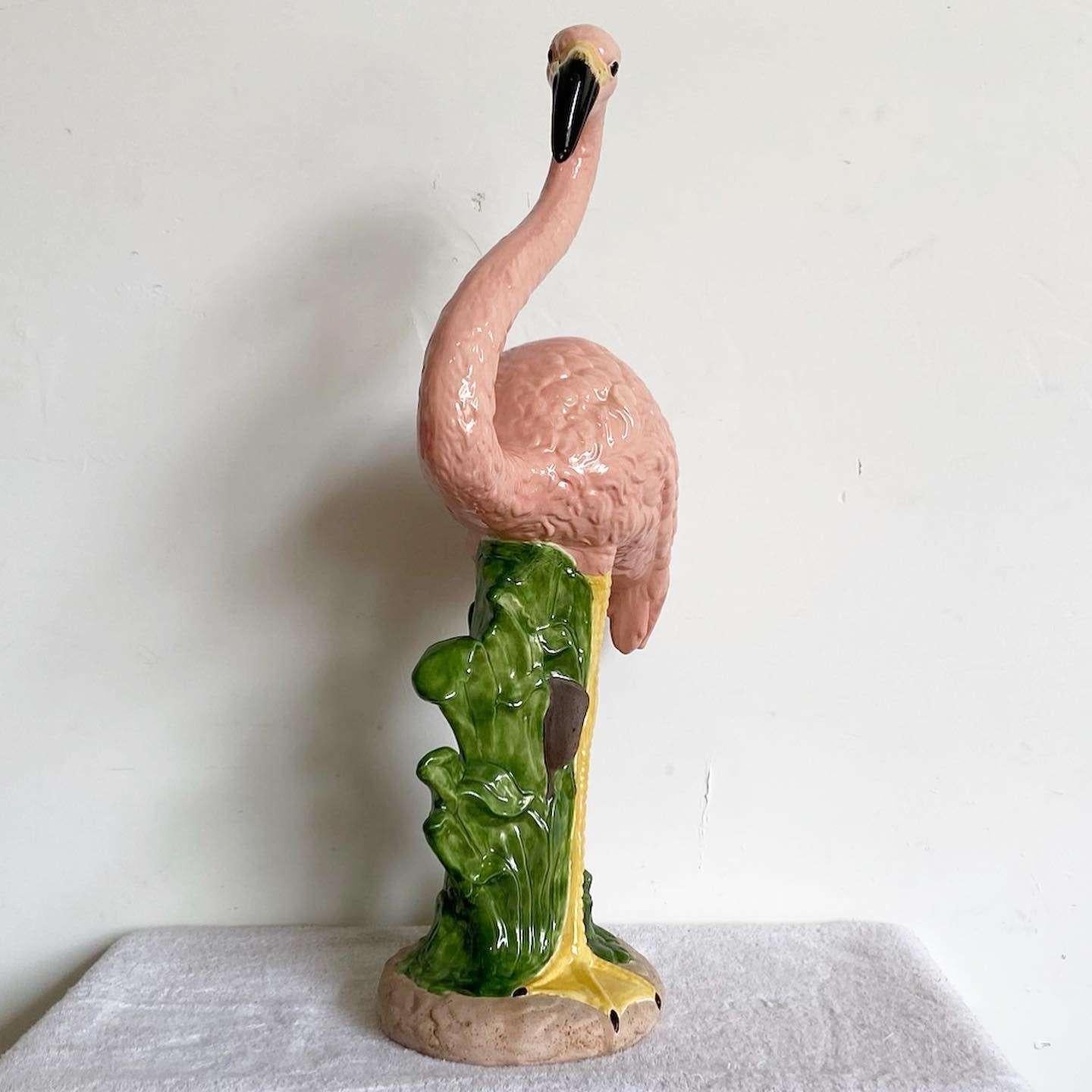 Exceptional vintage ceramic flamingo sculpture. Hand painted pink and green, it is almost life size.


