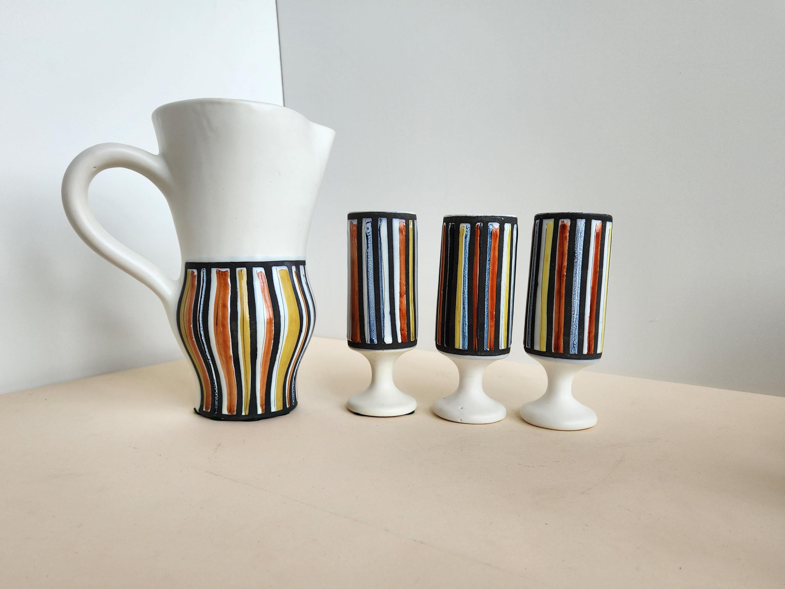 Vintage Ceramic Pitcher and 3 Goblets with Vertical Stripes signed by Roger Capron - Vallauris, France

Roger Capron was in influential French ceramicist, known for his tiled tables and his use of recurring motifs such as stylized branches and