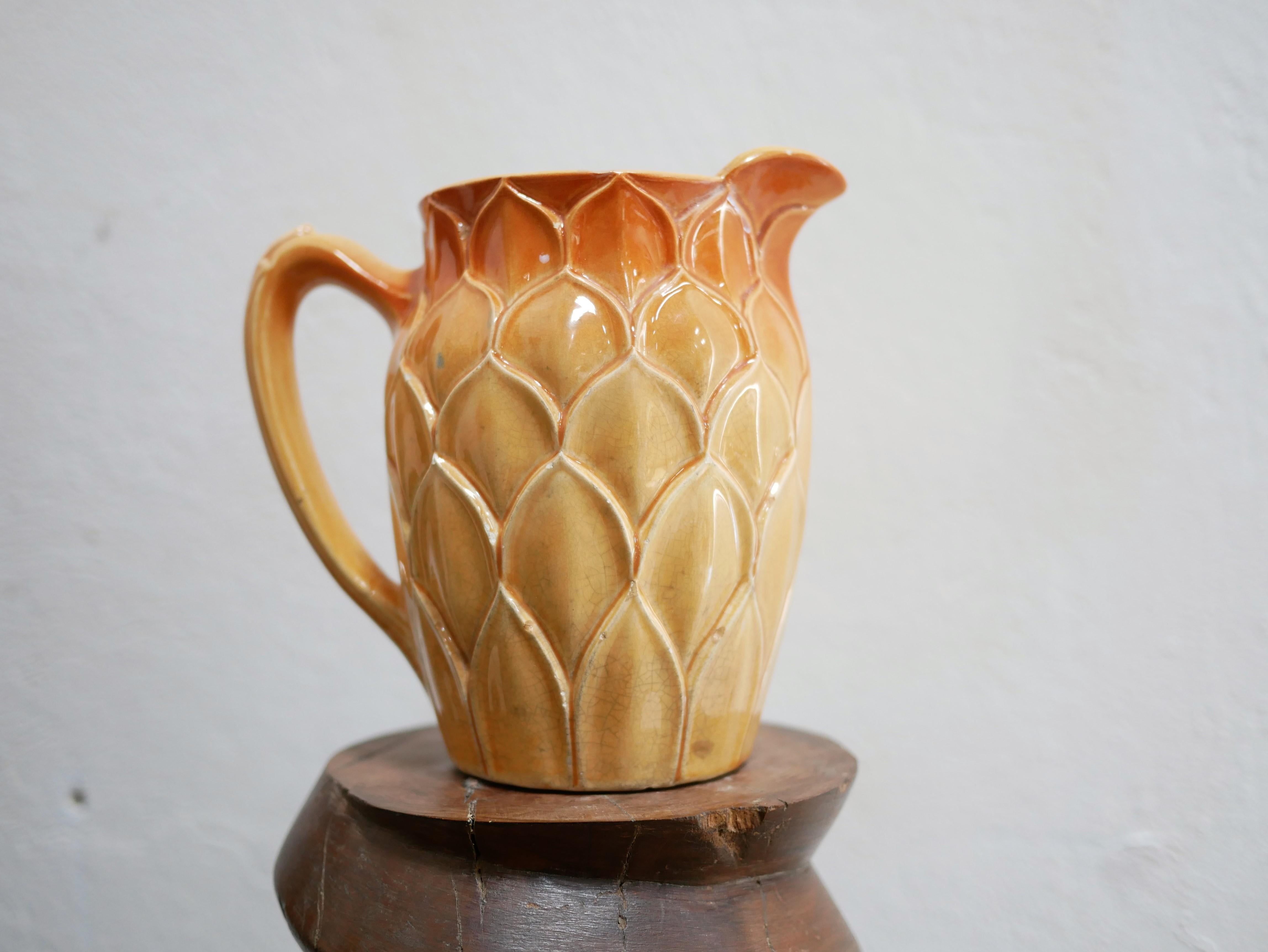 Slip pitcher designed by the Saint Clément factory in the 1930s.

Trendy and current, this 