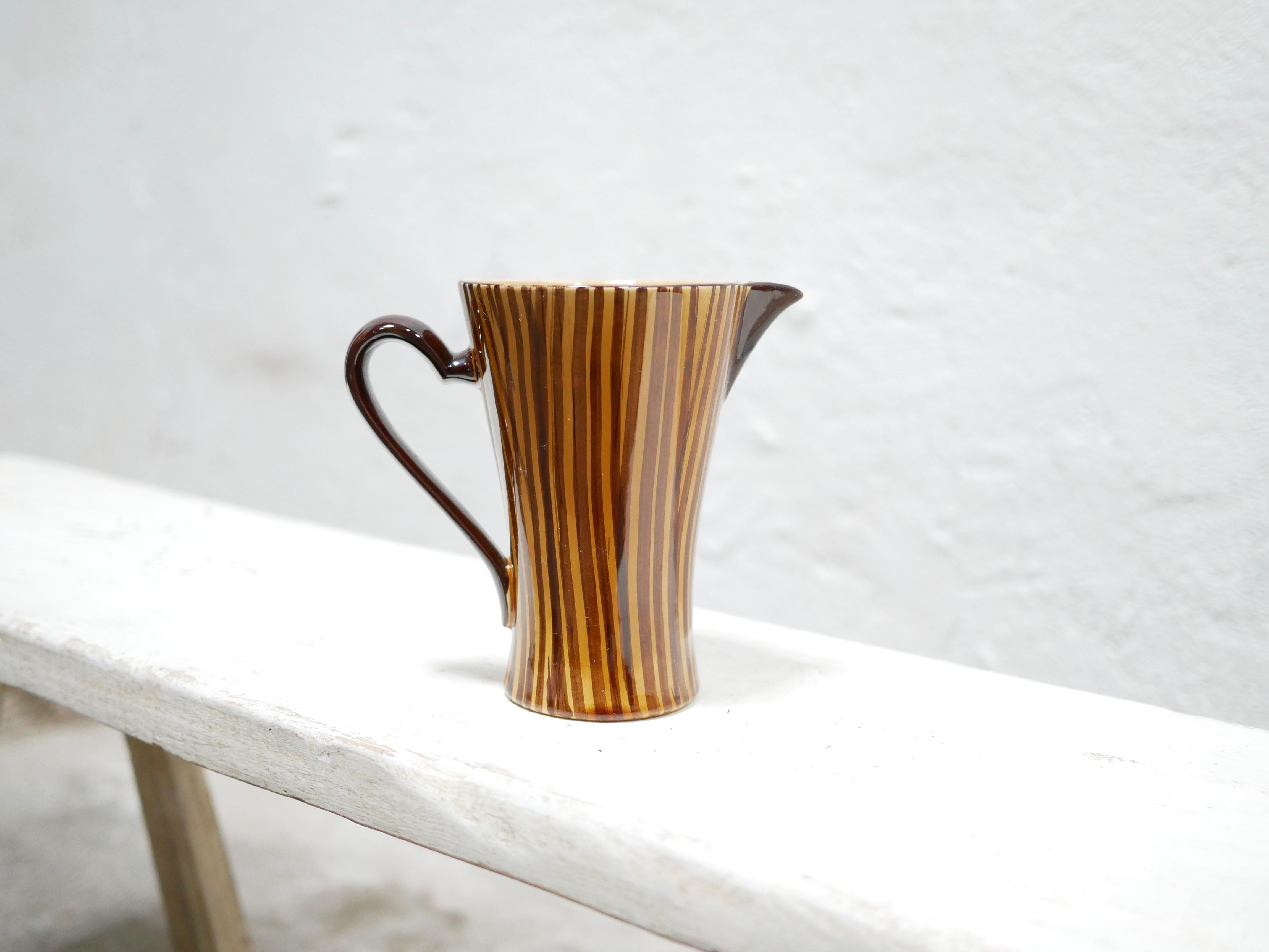 Ceramic pitcher designed by the Sarreguemines factory, France, in the 1960s.

With its modern shape and mineral hue, this ceramic will be perfect in a natural, refined and delicate decoration.
We simply imagine it placed on a shelf or piece of