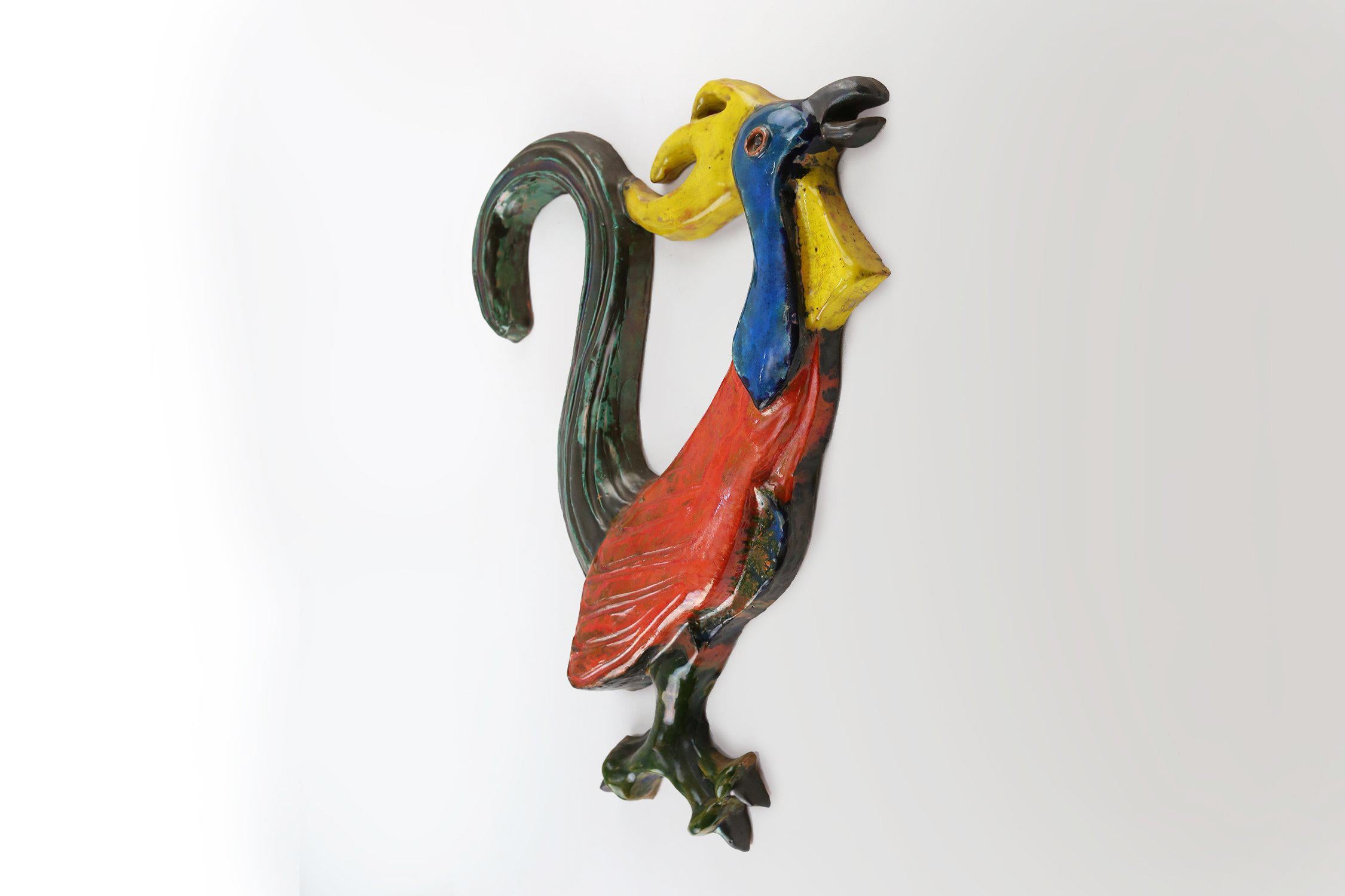 Belgio / 1962 / Plaquette / A. Dandoy / ceramica / Vintage / Mid-century

Bellissima plaquette da parete in ceramica raffigurante un gallo con un potente smalto rosso, blu, giallo e verde. Firmato sul retro dall'artista belga A. Dandoy, Le Zoute,