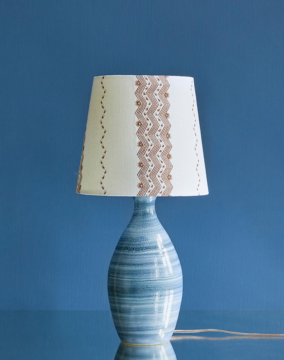 France, 1970's

Ceramic table lampe in blue glaze with customized shade by The Apartment.

H 43 x Ø 22 cm