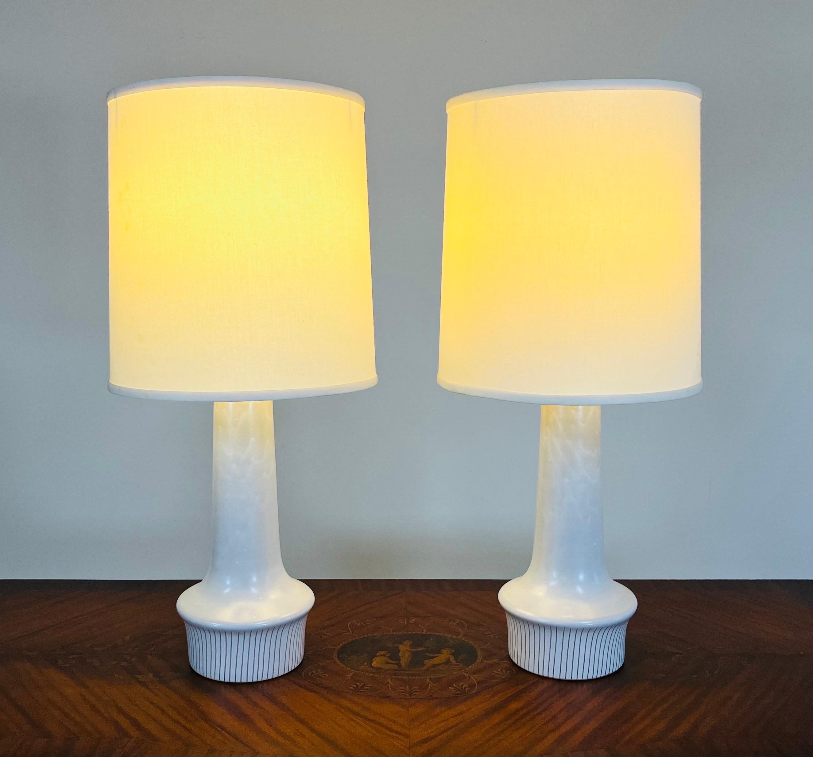 A beautiful pair of sculptural ceramic table lamps designed by Gordon & Jane Martz for Marshall Studios circa 1950. 
 Both lamps are signed on back. 
 In excellent vintage condition having no scratches or chips. 
Shades are optional for an