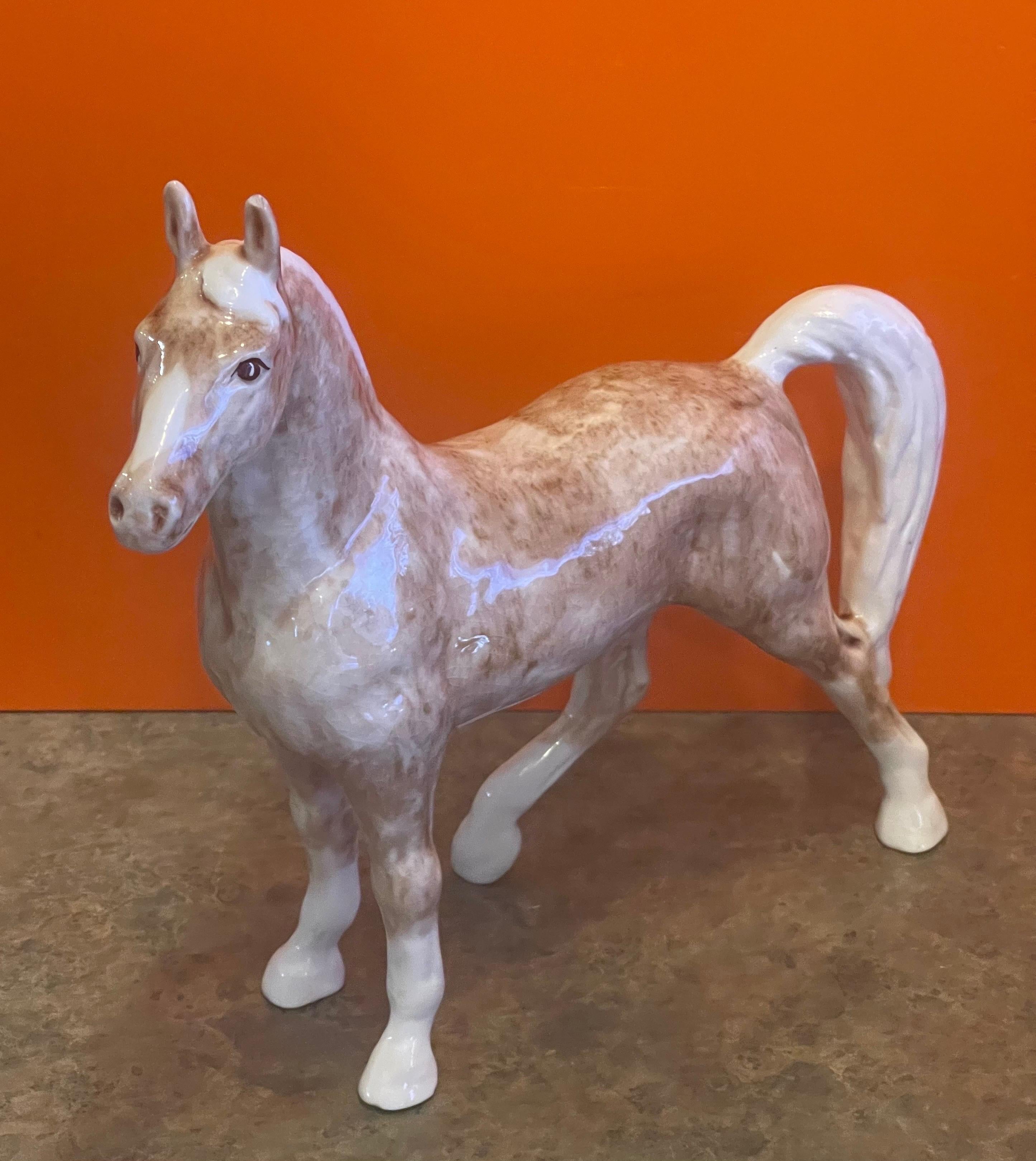 A great handmade ceramic tan horse sculpture by Dorothy Kindell, circa 1940s. This rare piece is quite large, in good vintage condition some minor crazing is present and measures approximately 11