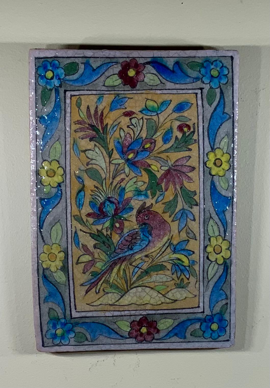 Exceptional tile all hand-painted and glazed with beautiful scenery of colorful bird vines and flowers on a camel color background. All surrounding by very intricate border. Could hang on the wall.
Great object of art for wall display.

 