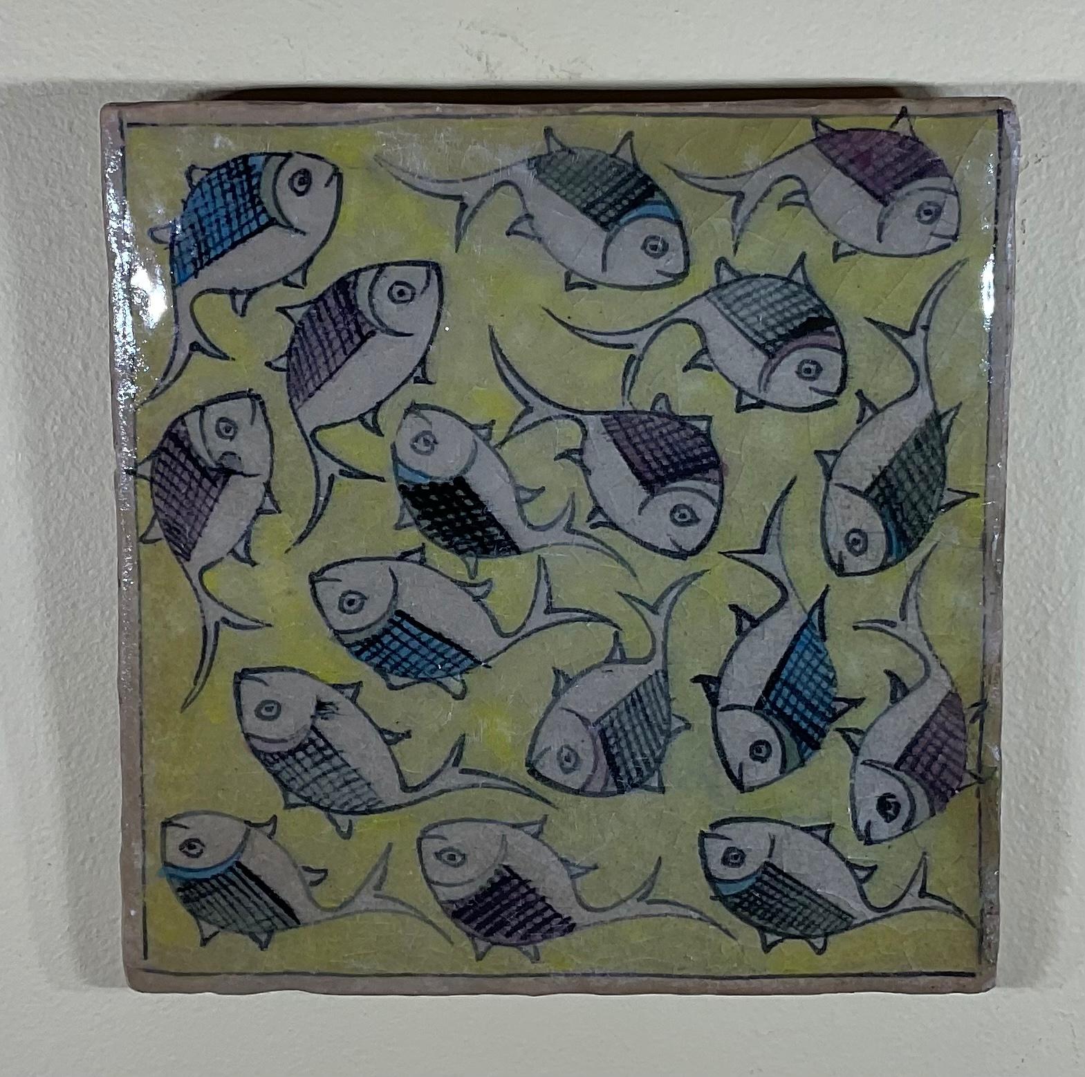 Beautiful tile hand painted and glazed with exceptional wondering colorful school of fish on a yellow color background. The tile can hang on the wall. Exceptional object of art for wall display.