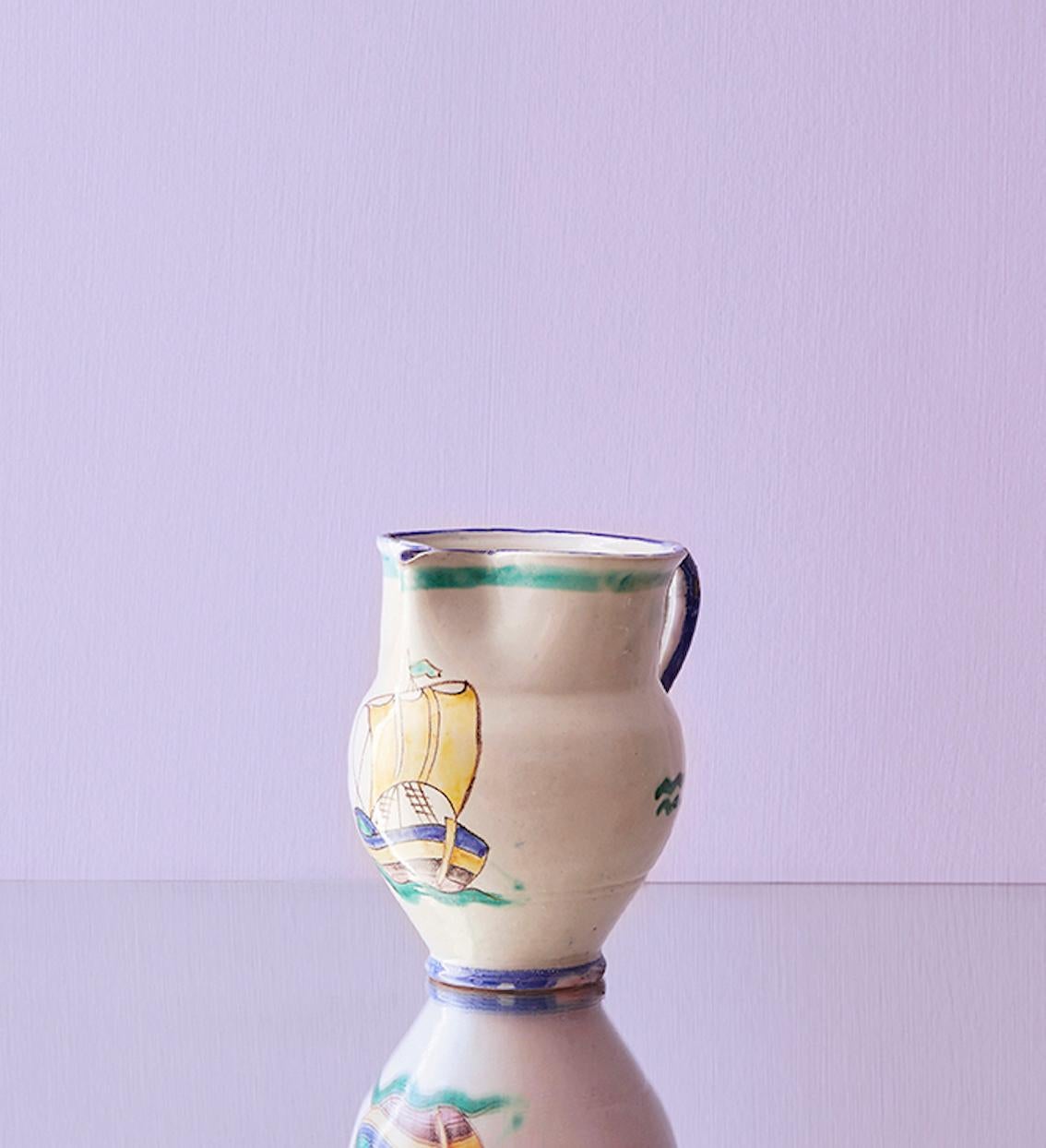 Italy, vintage

Vietri ceramic pitcher.

Measures: H 19 x W 14.5 x D 19 cm.