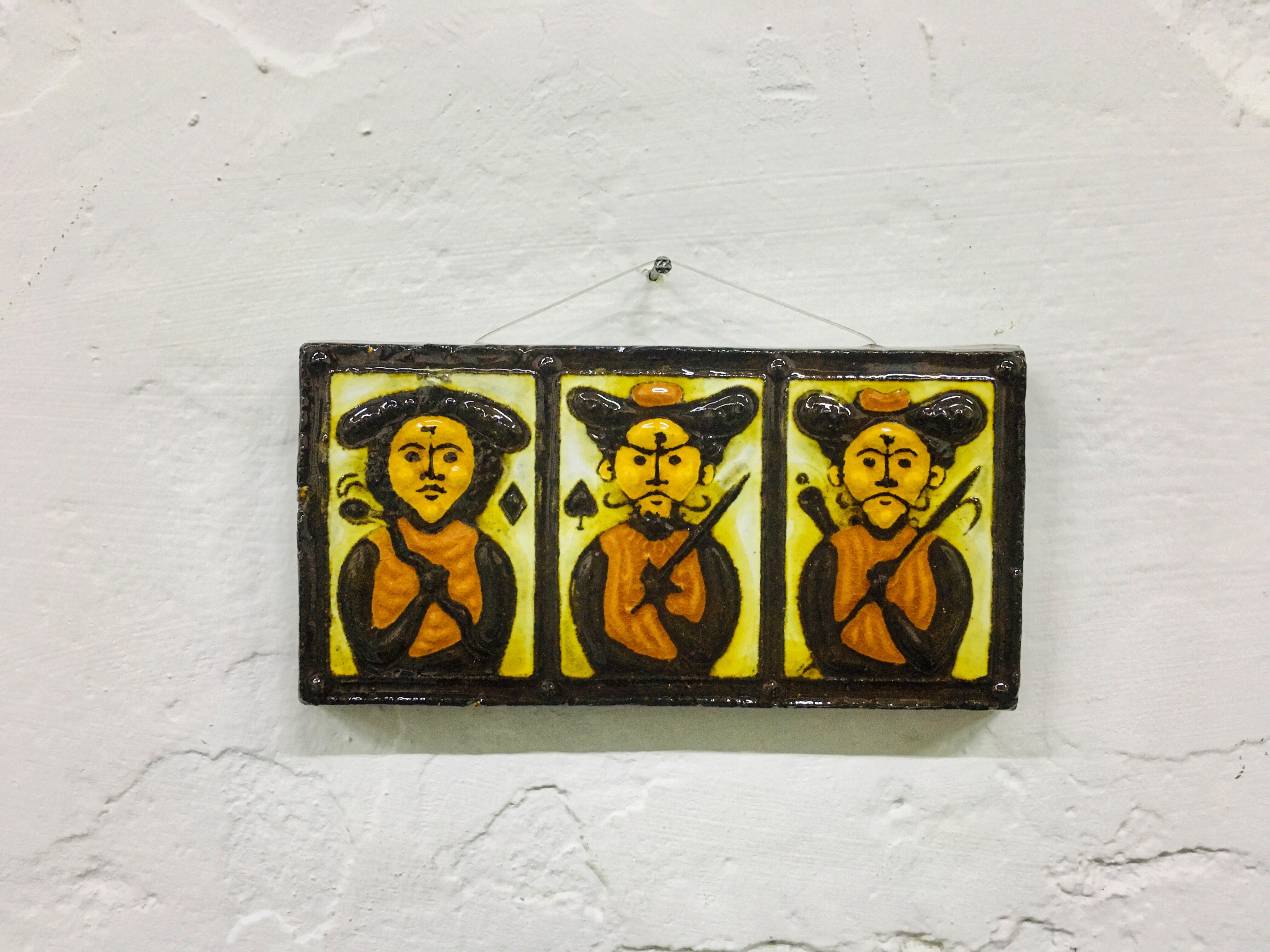 Artwork of Éva Balássy ceramic artist. Wall decor portrais three male figure. Marked on the back: 