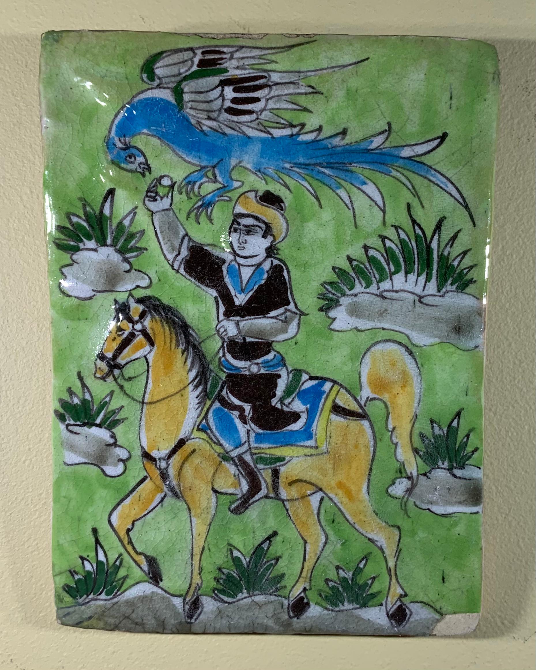 Beautiful hand made and painted, glazed tile, with a Man on a horse holding bird probably falcon.
The tile can hang on the wall.