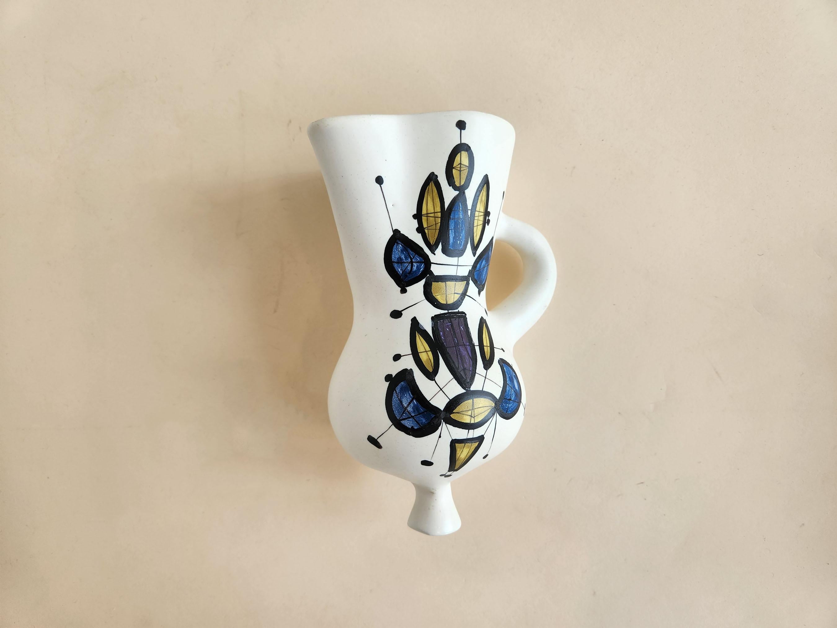 Vintage Ceramic Wall Mounted Vase with Abstract Motif by Roger Capron - Vallauris, France

Roger Capron was in influential French ceramicist, known for his tiled tables and his use of recurring motifs such as stylized branches and geometrical suns. 