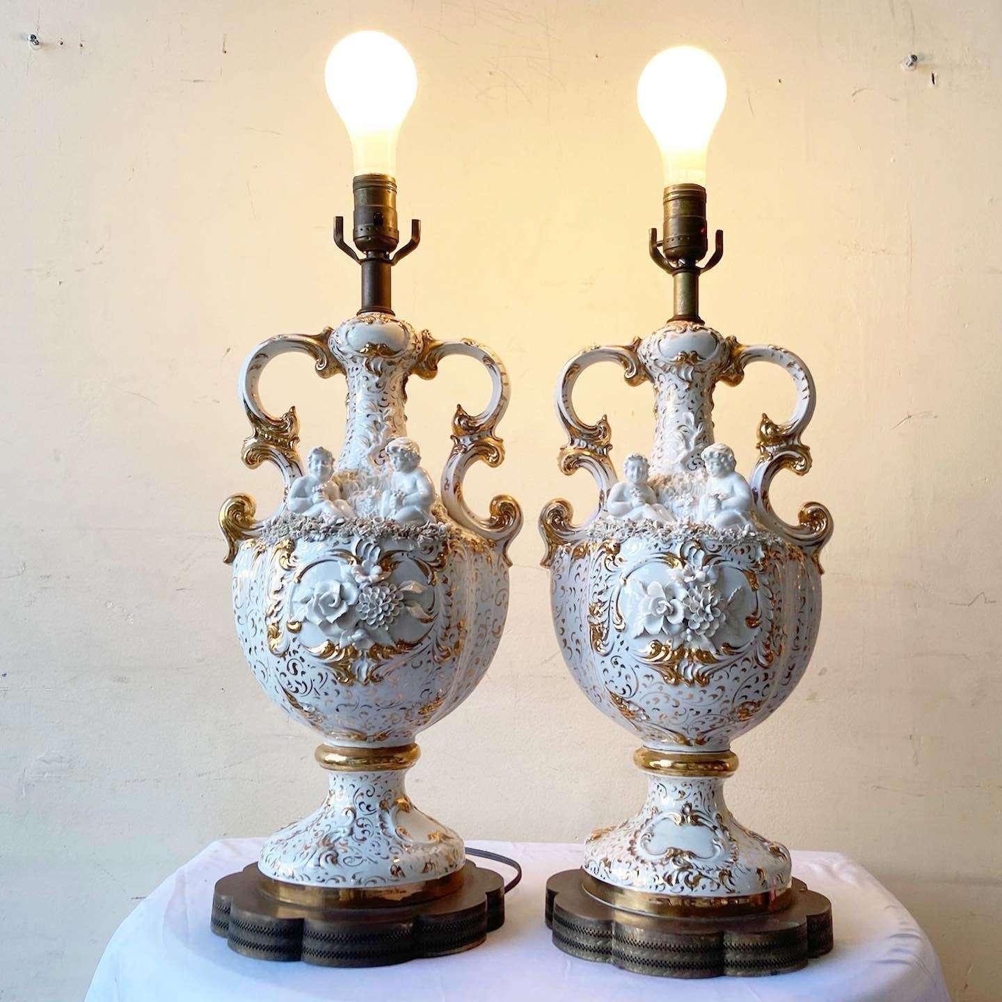Vintage Ceramic White and Gold Cherub Trophy Table Lamps - a Pair In Good Condition For Sale In Delray Beach, FL