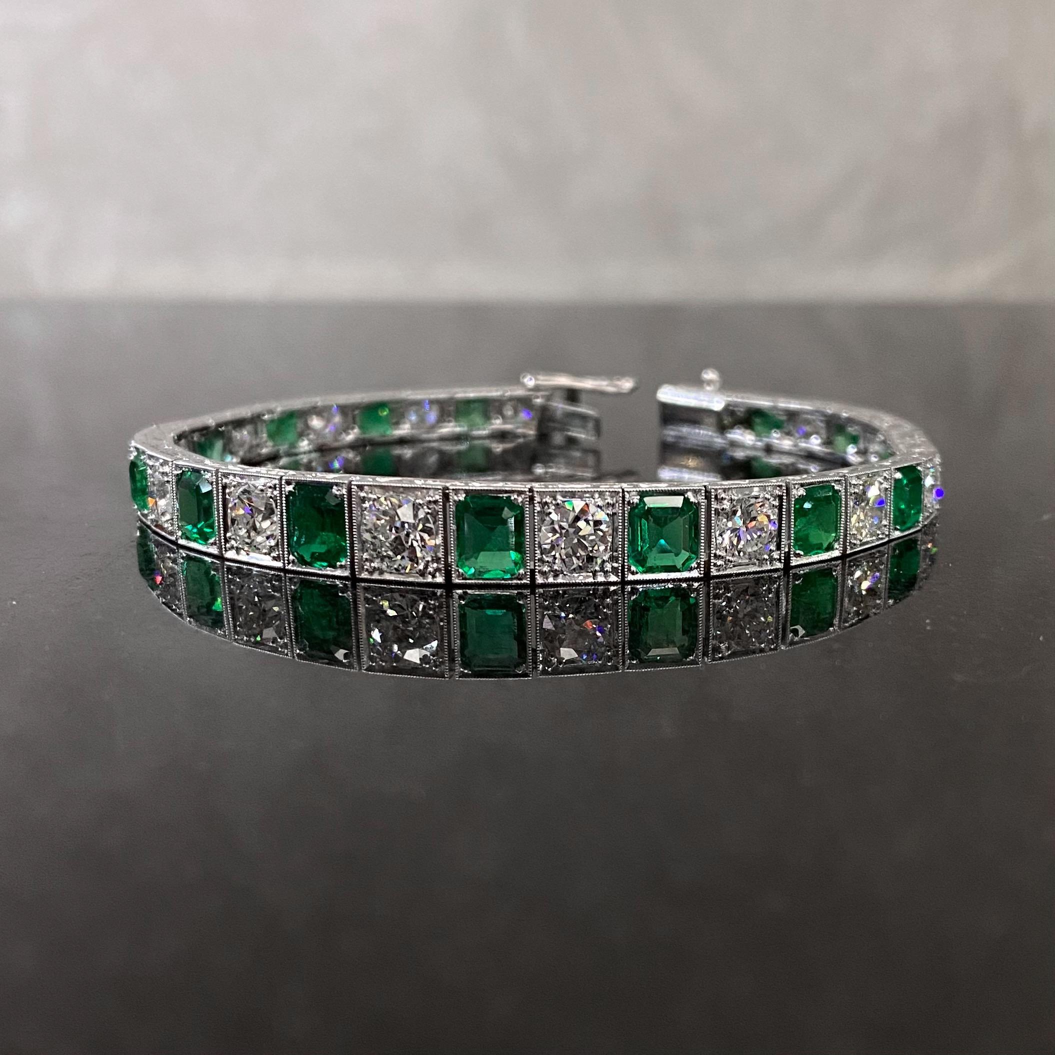 A breathtaking certified Colombian emerald and diamond line bracelet in platinum and white gold, circa 1990. This Art Deco style vintage geometric tennis bracelet of a slightly tapered design is composed of 18 emerald-cut and squared emerald-cut