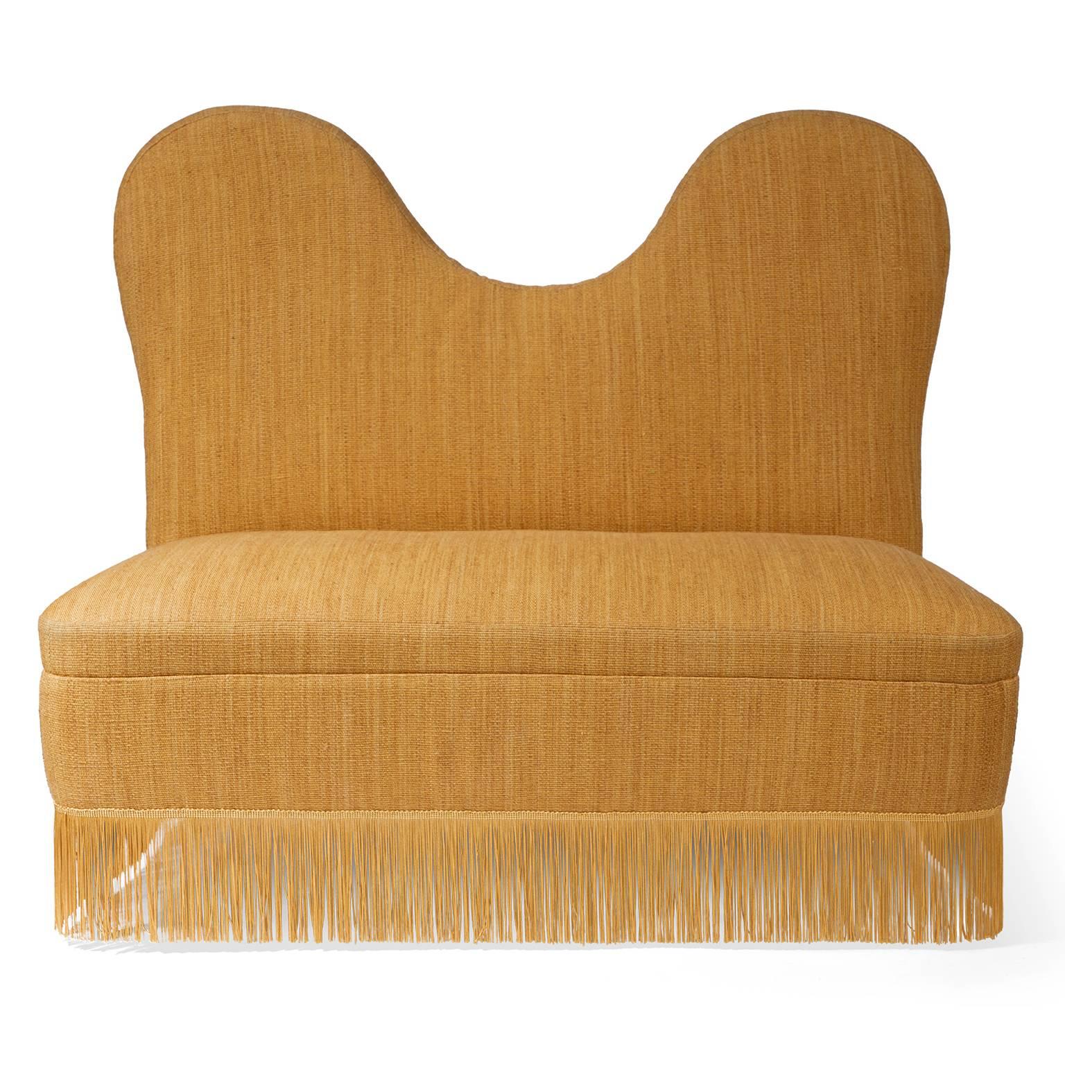 Designed by Italian architect Cesare Lacca, this vintage settee is a rare example of Lacca's seating. Restored and reupholstered in jute and cotton Pampa fabric, the sofa glows in deep gold. Each yarn is hand-dyed to create a tactile weave, while