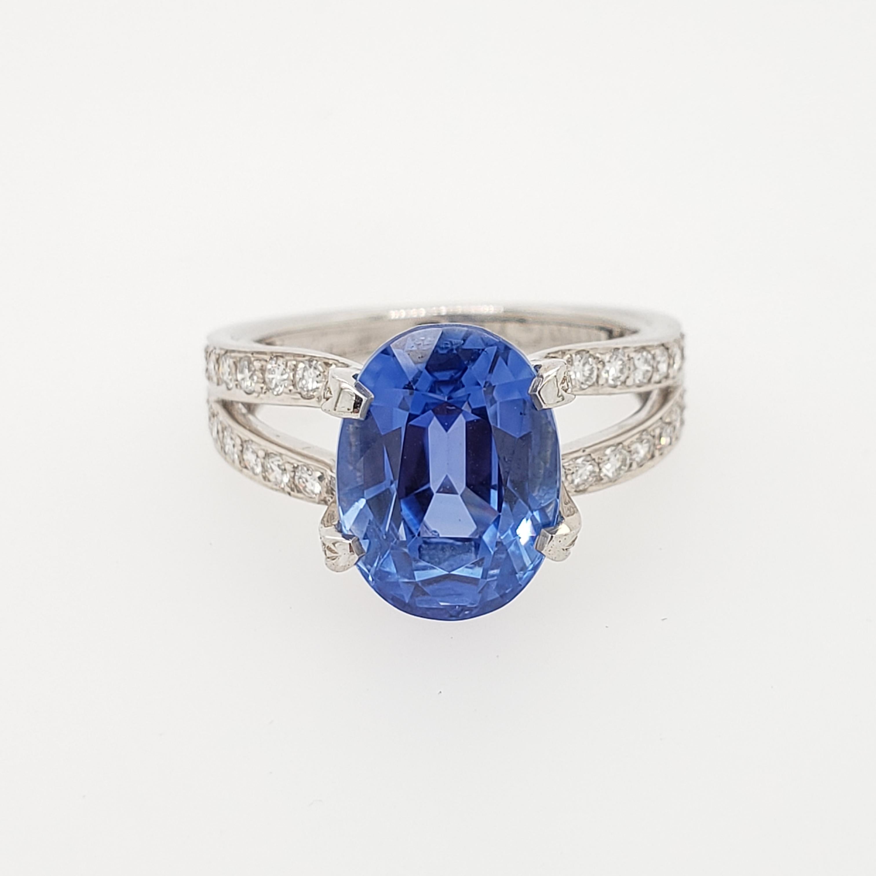 VINTAGE Tiffany Platinum ring featuring Oval  Ceylon sapphire weighing  6.76 ct,  not heated, AGL certificate, CS1074739 (4/26/16). Split shank set with 58 round diamonds weighing approximately 0.80 ct . Size
6 1/4. 6.92 gr.