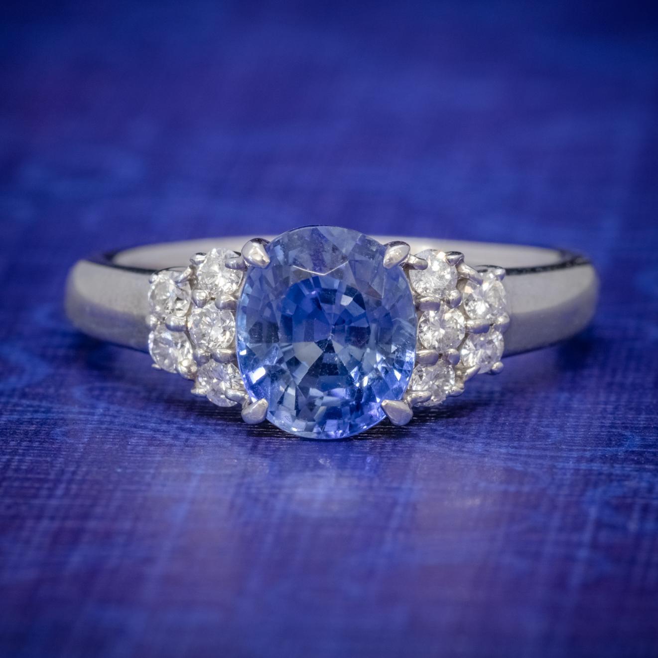 This elegant Vintage ring is modelled in solid Platinum and boasts a vibrant, royal blue, Ceylon Sapphire weighing 2.50ct and flanked by five sparkling brilliant cut Diamonds on each shoulder.

Ceylon Sapphires are adored for their vivid blue