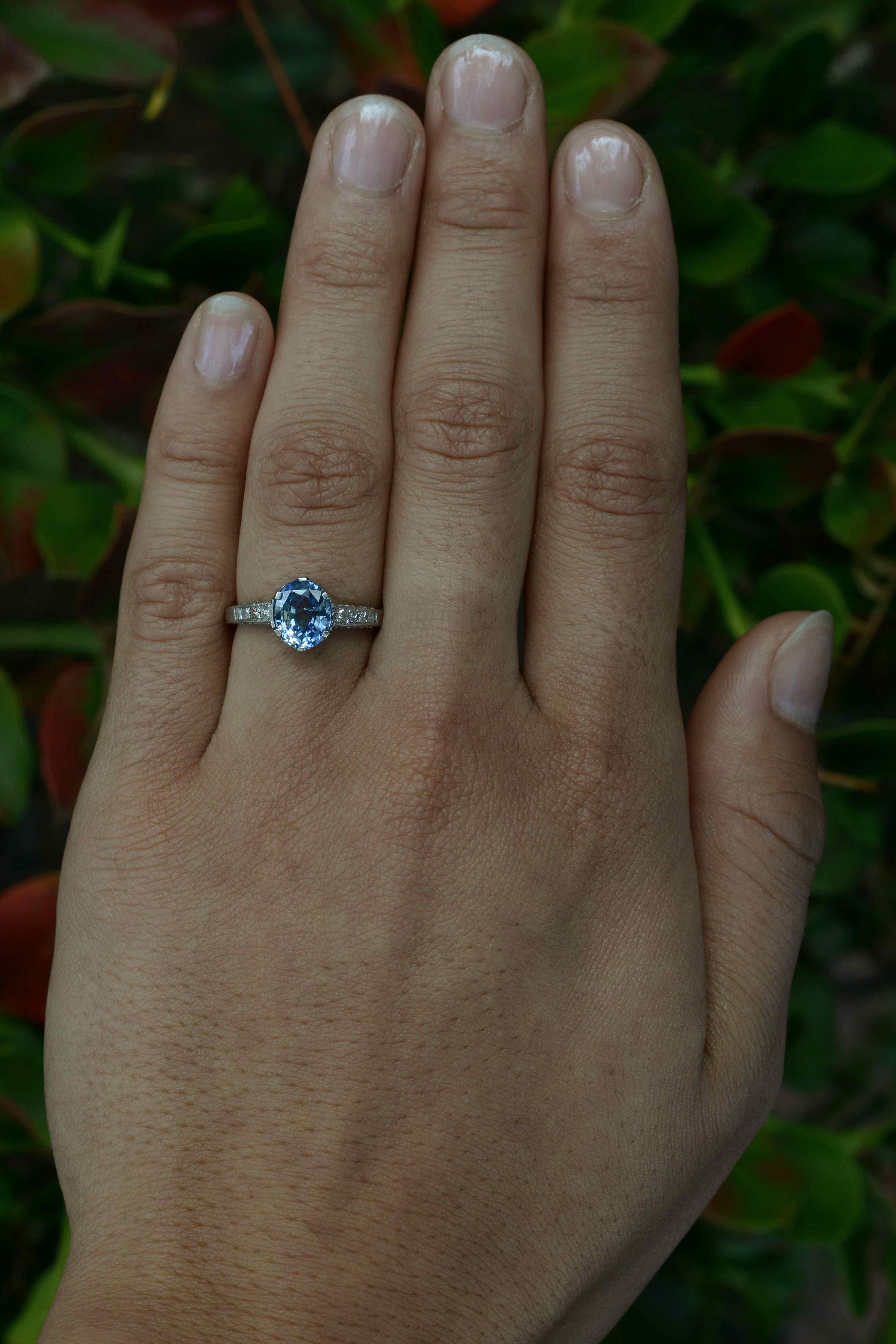 A charming, elegant, natural vintage Ceylon sapphire engagement ring, an intriguing gemstone solitaire centered by the most delightful cornflower blue sapphire of 1.53 carats with a soothing, velvety tone. The platinum 6 prong setting holds the gem