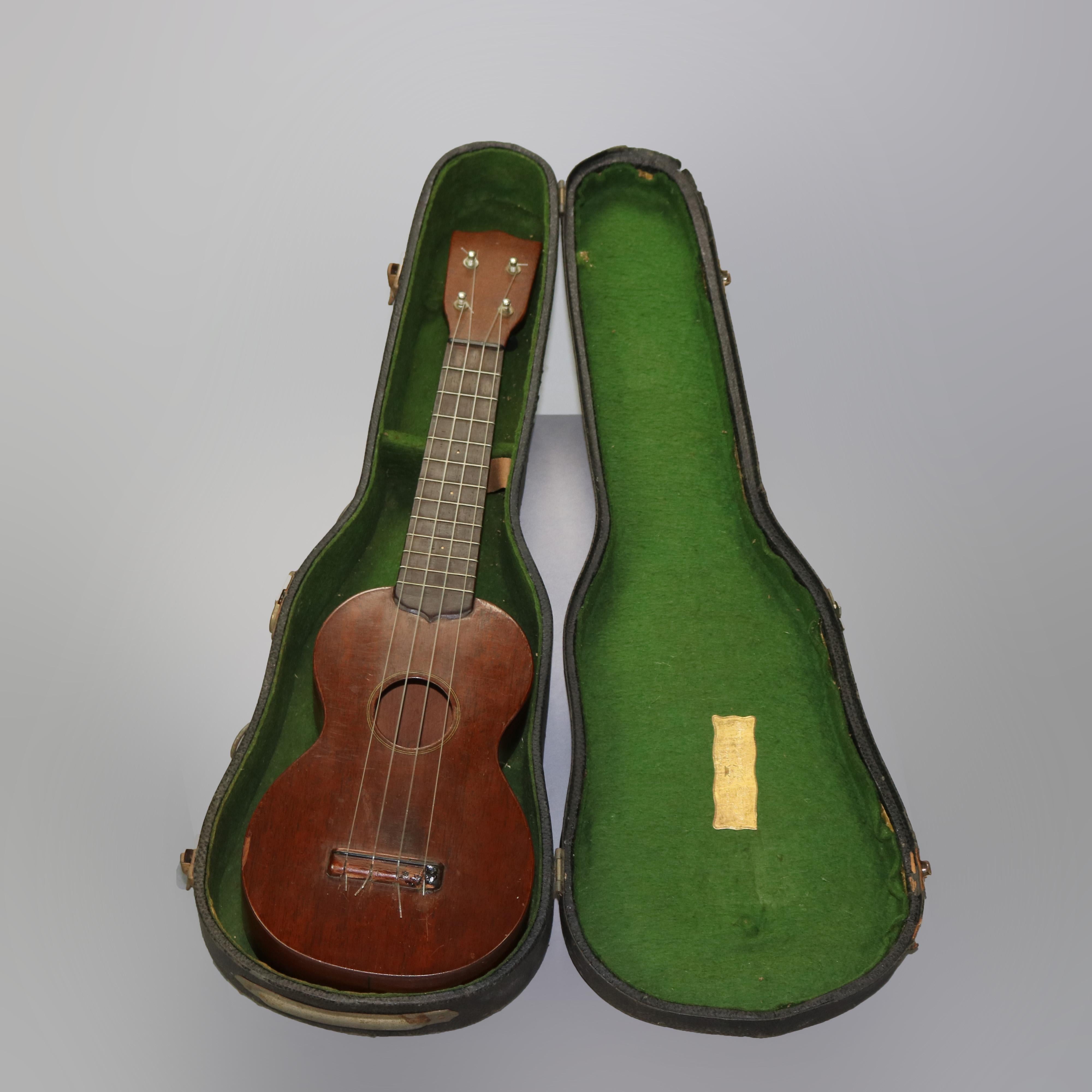 A vintage uke by C.F. Martin & Co. offers mahogany construction and case, en verso maker signed as photographed, (string instrument, guitar), 20th century 

Measures - Ukulele 21'' long x 6.25'' widest x 2.5''deep; Case 8'' x 22.5'' x 3.5''.