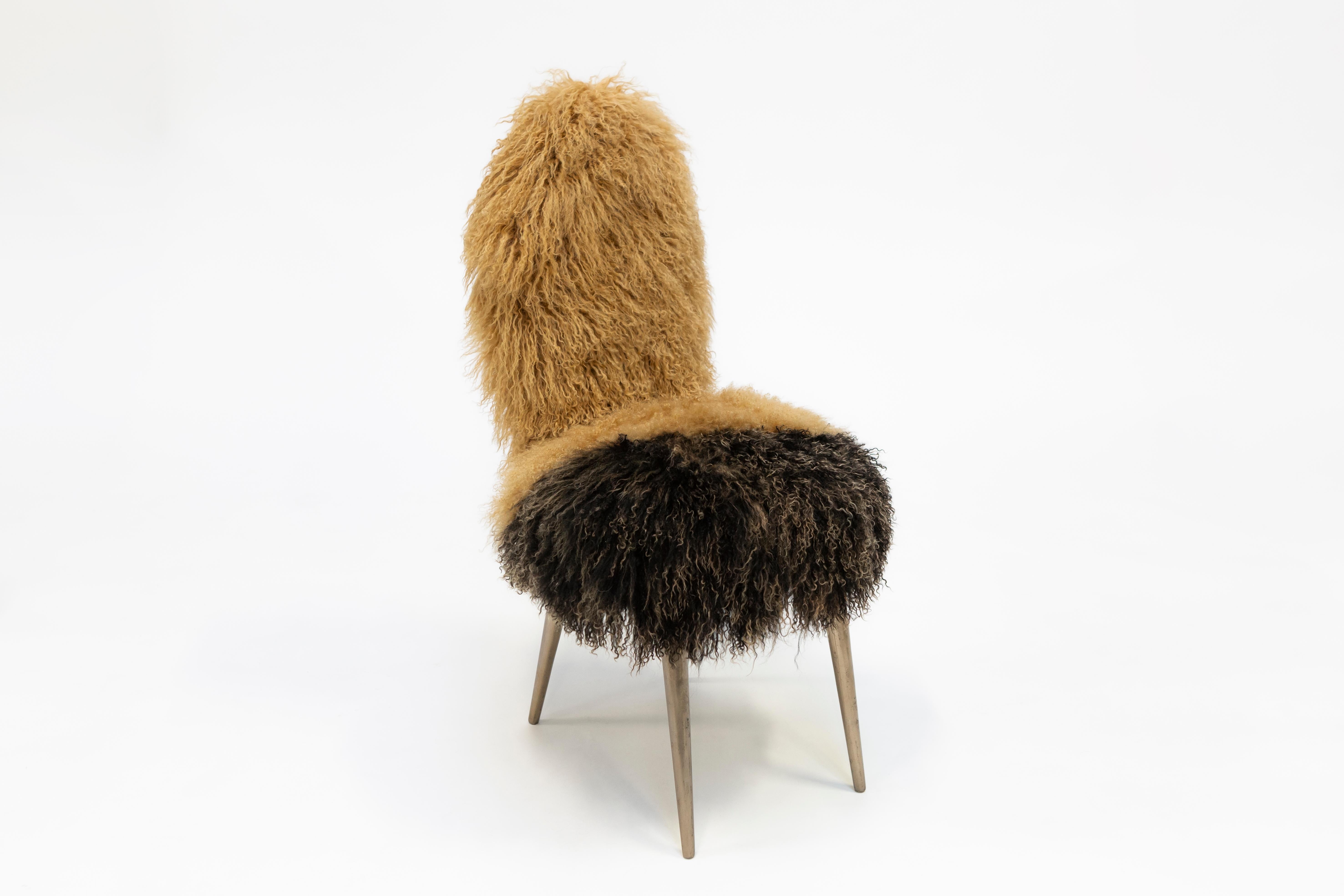 Dialoghi Mimetici collection by Draga&Aurel:

Original Italian 1950 chair designed by Umberto Manscagni. Structure in wood. Upholstery in second-hand Mongolia furs. Legs in cast bronze.


Color black-beige. Size: cm L 45, W 51, H 99
Please note that