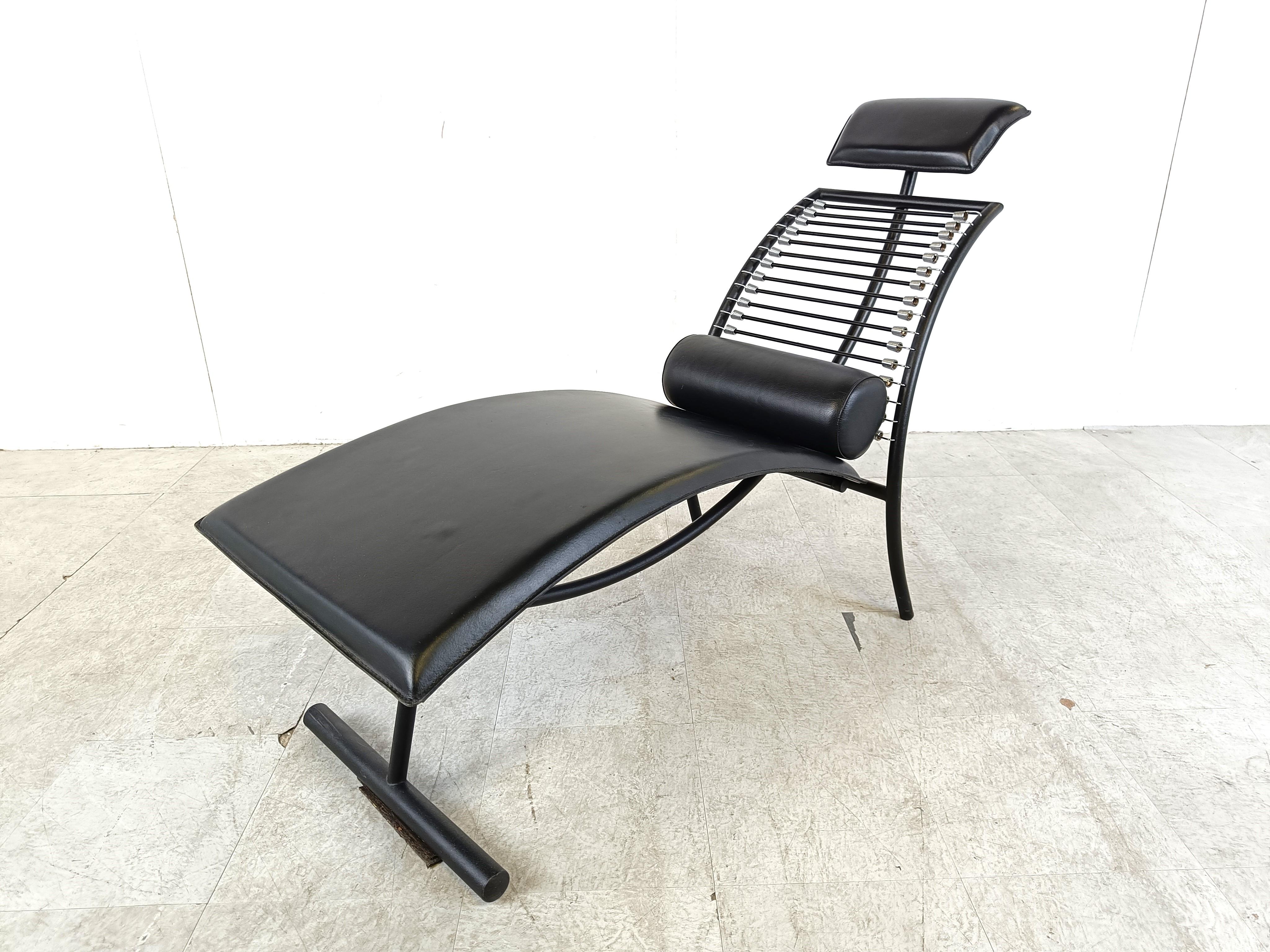 Vintage 'chaise longue' made from a elegant chrome frame, elastic cords and black leather cushions.

Rare and beautiful lounge chair very much in the manne of Rene Herbst 'sandow' chair.

The chair has beautiful curves and has a timeless appeal.