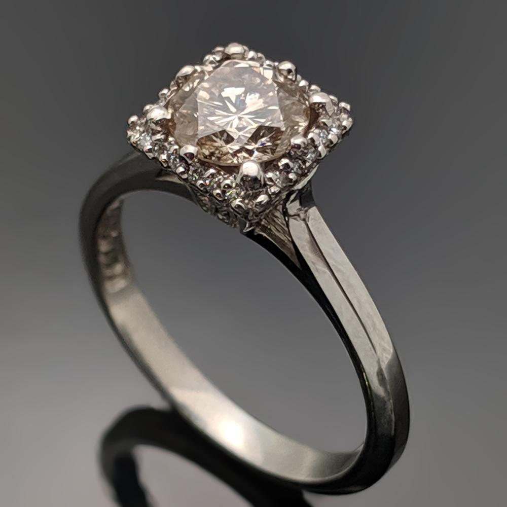 A vintage platinum ring featuring an eight pronged square setting with center, brilliant-cut Champagne diamond with an estimated weight of 0.92ct. Estimated weight of platinum 3 gr. 

We will size it for you.

