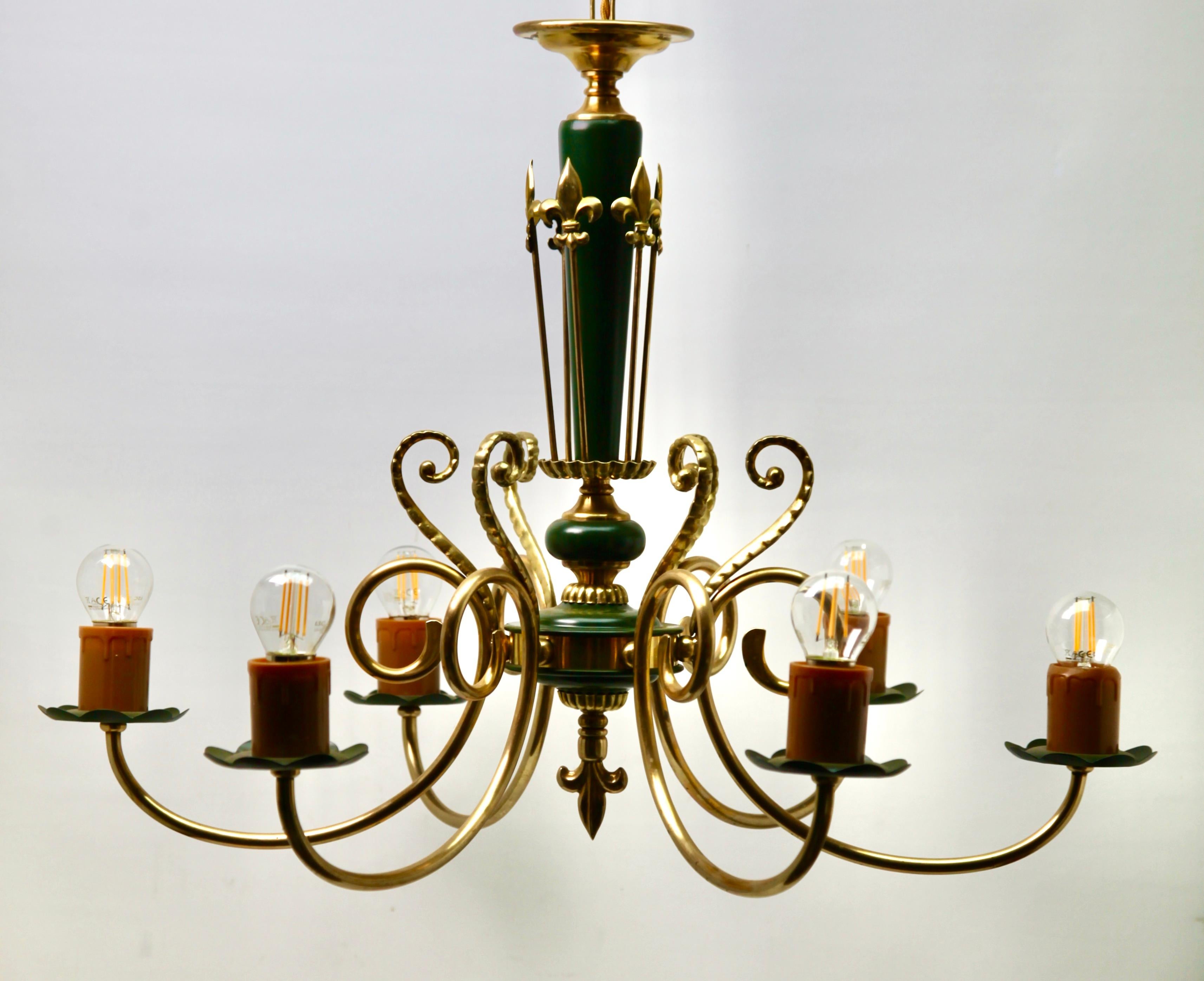 Six arms chandelier brass and wooden details
Photography fails to capture the simple elegant illumination provided by this lamp.

Recently cleaned and polished so that it is in excellent condition and in working order having also
been re-wired