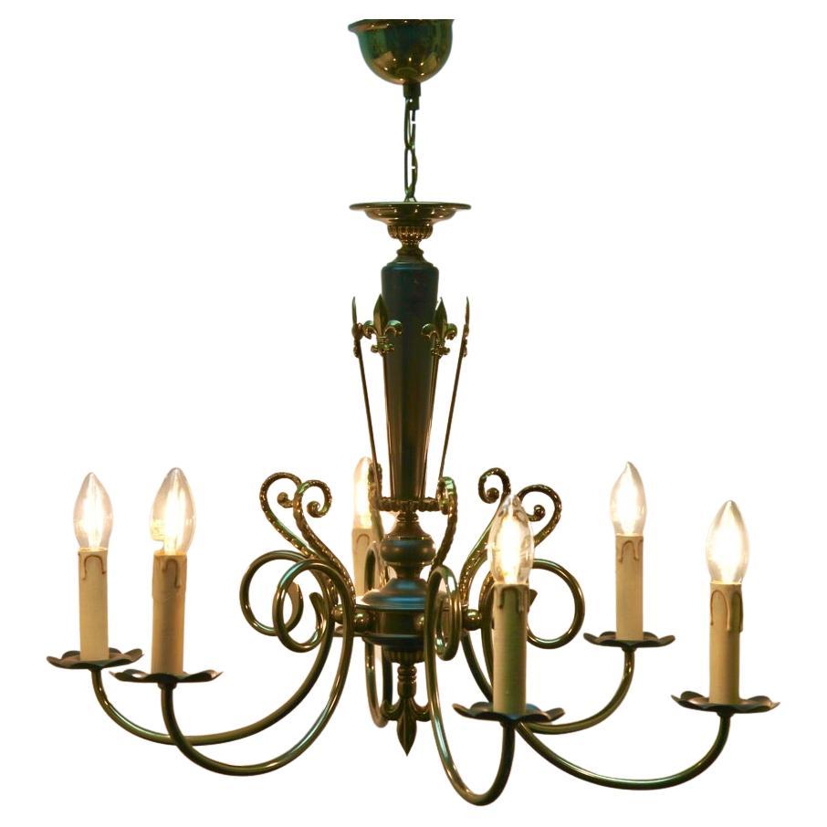 Six arms chandelier brass and wooden details
Photography fails to capture the simple elegant illumination provided by this lamp.

In excellent condition and in working order having 
With Original Patina on all Parts.

And safe for immediate