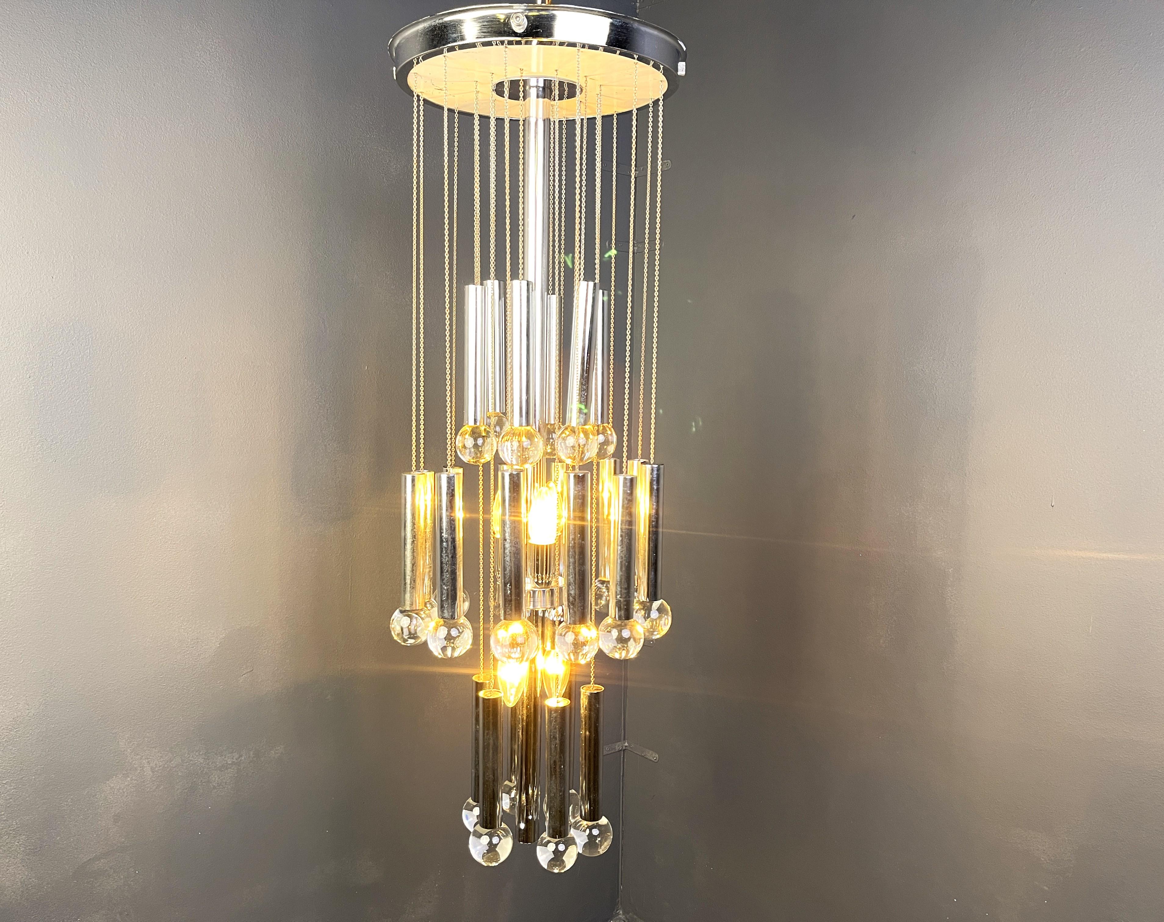 Large cascading chandelier by Gaetano Sciolari with chromed tubes and glass beads.

The multi height levels create a nice light effect.

The chandelier has 8 E14 light bulbs

Tested and ready to use.

1970s - Italy

Height: 95cm
Diameter: 35cm

Ref: