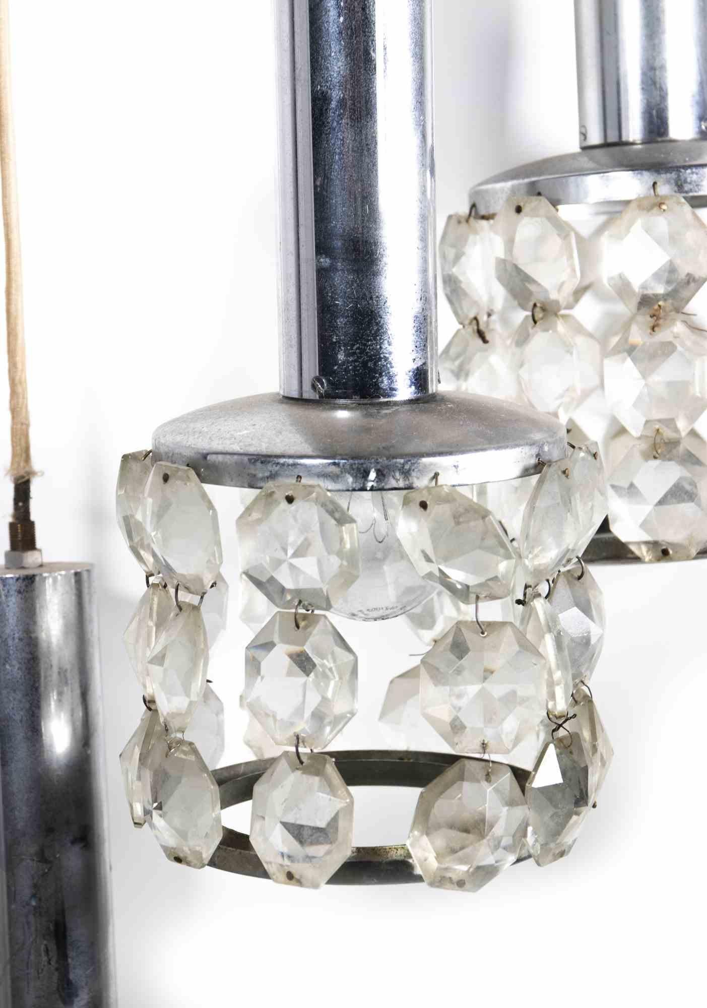 Vintage Chandelier by Gaetano Sciolari is an original design chandelier realized in the 1970s.

A very beautiful vintage lamp realized by the famous designer Gaetano Sciolari. 

The lamp is entirely realized in metal and glass.

Mint